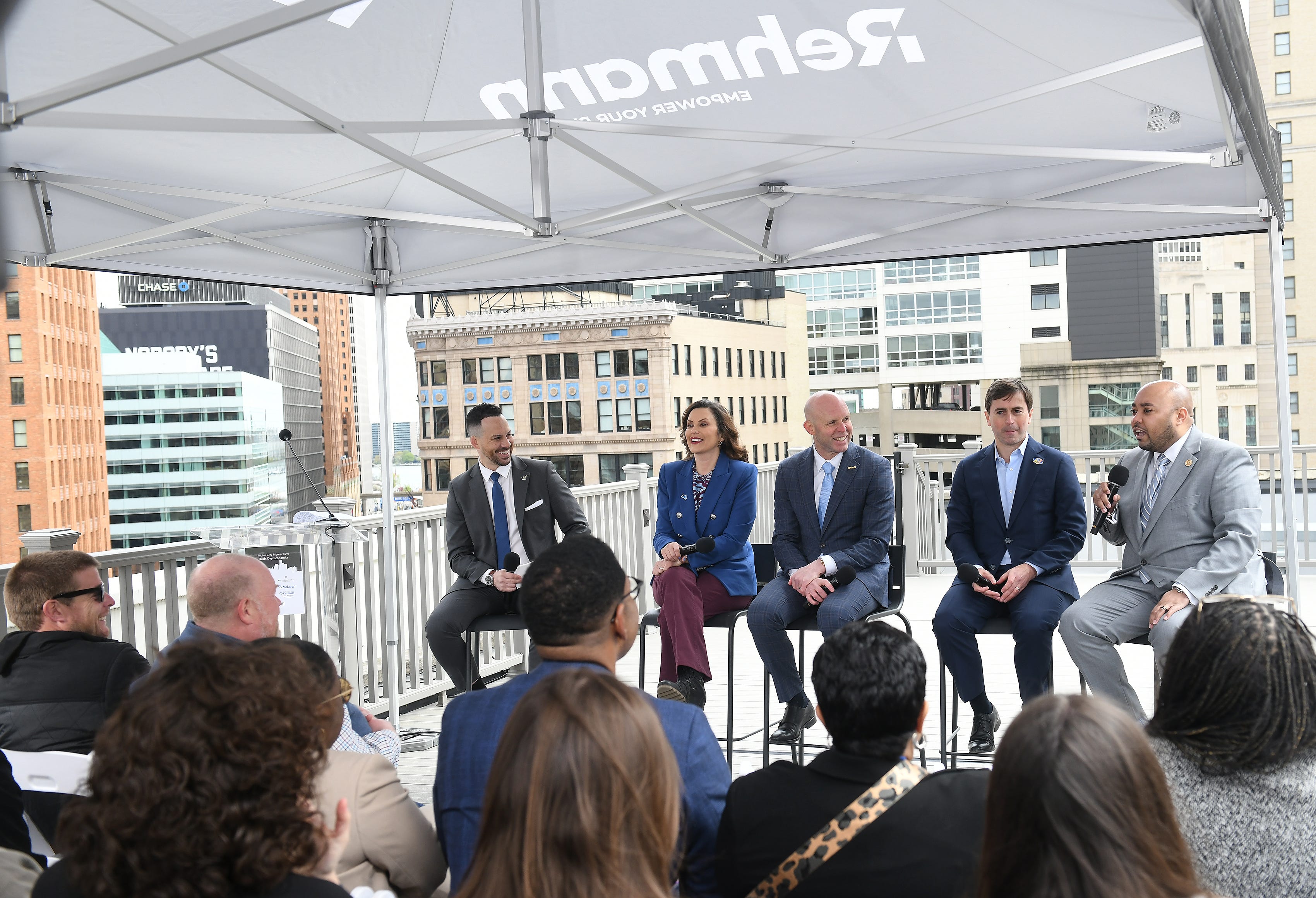 From left, Michigan Association of Broadcasters president Sam Klemet leads a discussion Wednesday about the economic impact of the NFL Draft in Detroit with Gov. Gretchen Whitmer, Visit Detroit president and CEO Claude Molinari, NFL Club Business, International and League Events vice president Peter O’Reilly and Detroit city councilman Fred Durhal III on the rooftop of a building on Griswold.