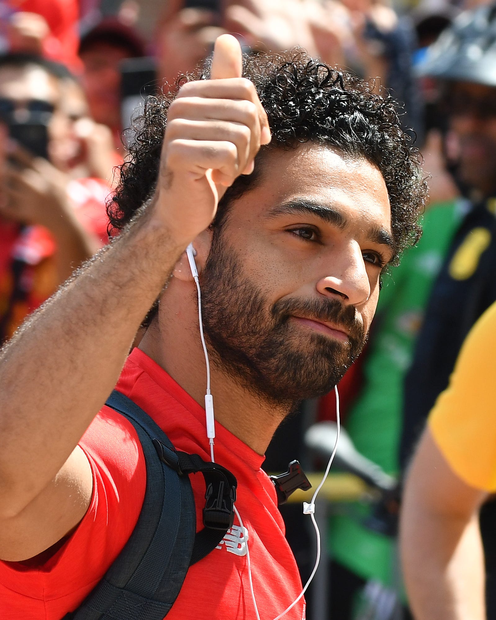 Liverpool midfielder Mohamed Salah gives the thumbs up as he arrives to Michigan Stadium for the game against Manchester United.