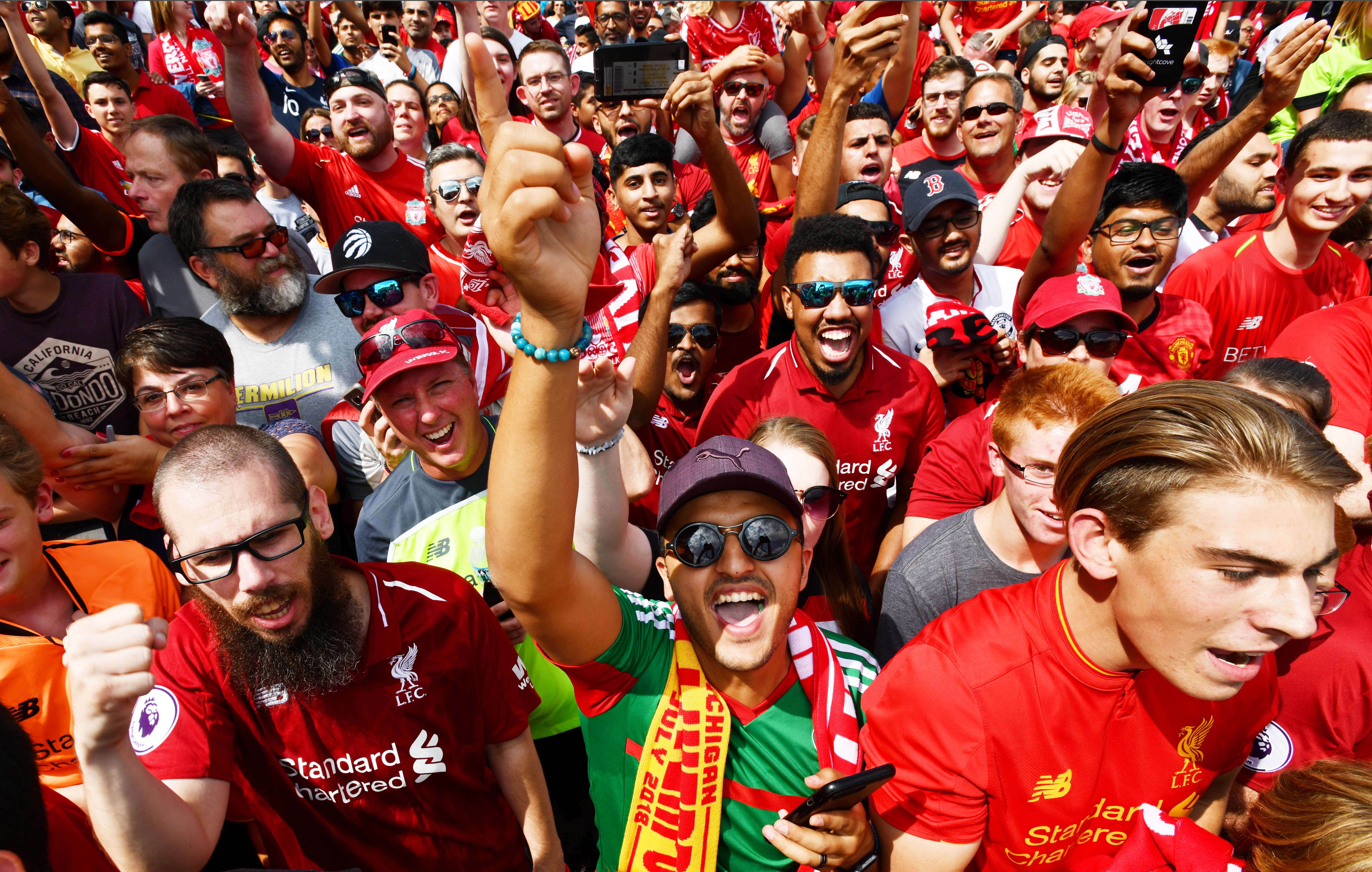 Manchester United and Liverpool fans cheer as they make their way into the stadium for the International Champions Cup match with Manchester United vs. Liverpool at Michigan Stadium.