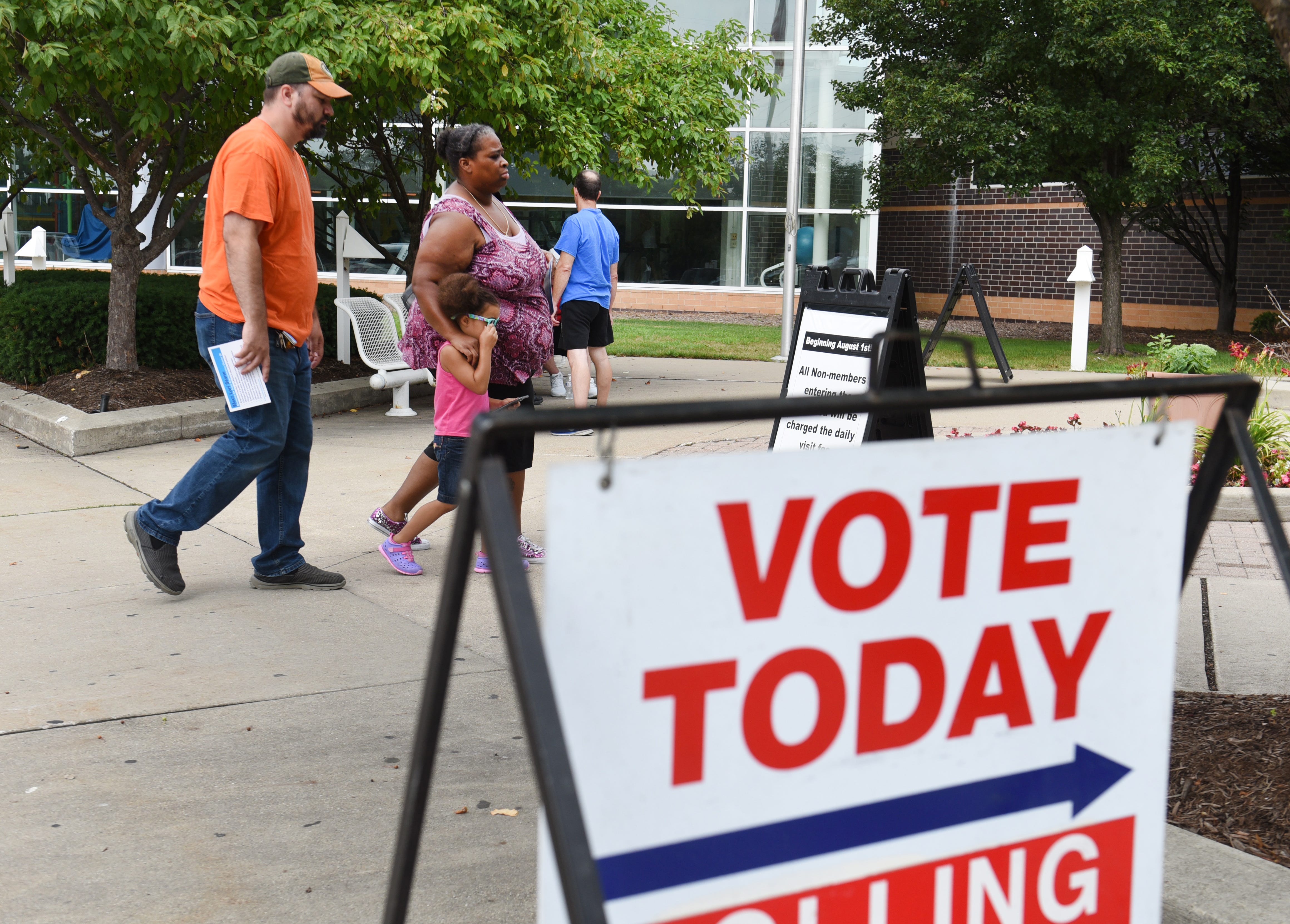 People enter the voting precinct on Tuesday outside Warren Community Center in Warren.