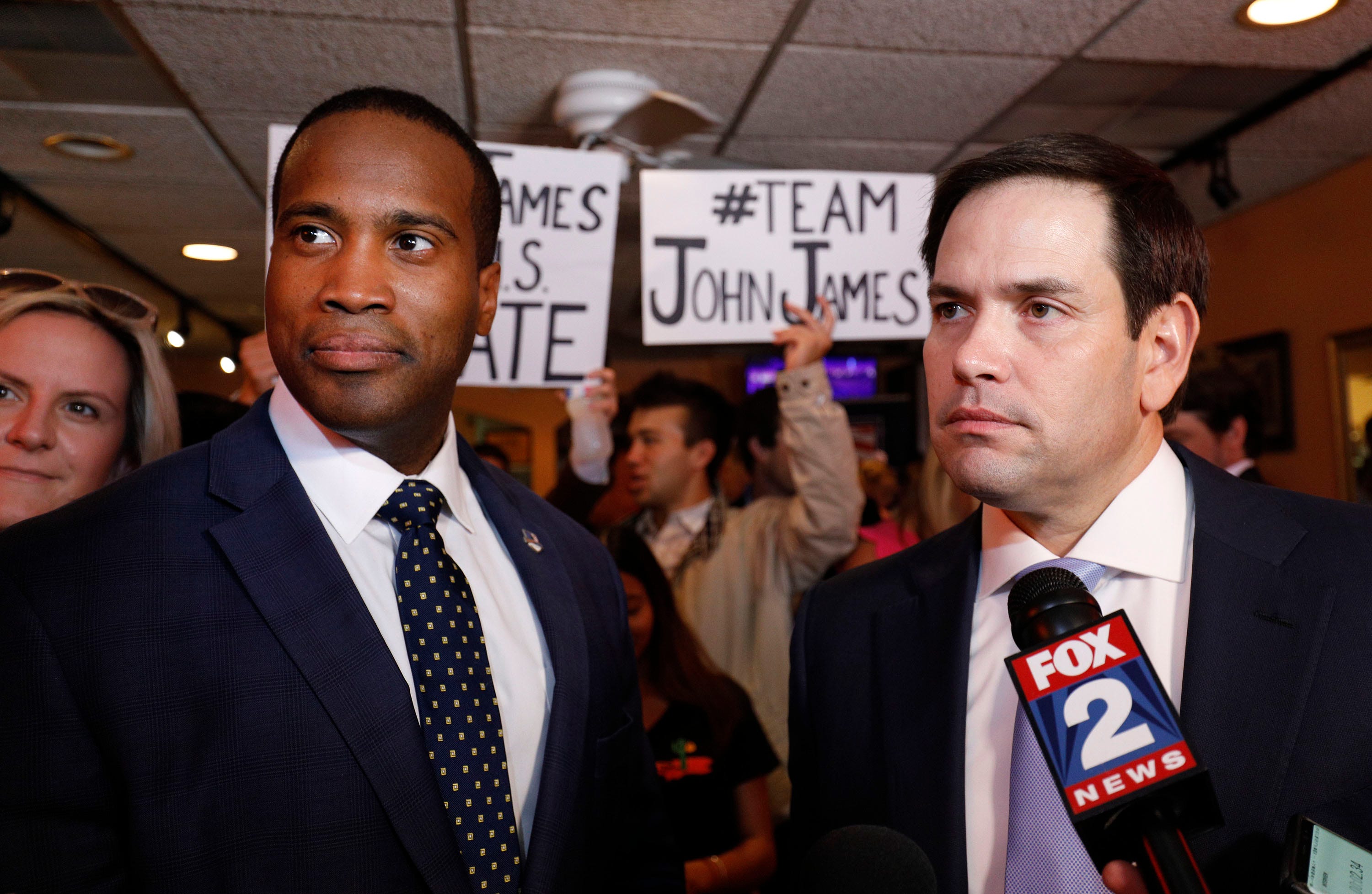 Michigan GOP U.S. Senate candidate John James, left, campaigns with the help of Sen. Marco Rubio (R-Florida), right, at Senor Lopez Restaurant Monday in Detroit.