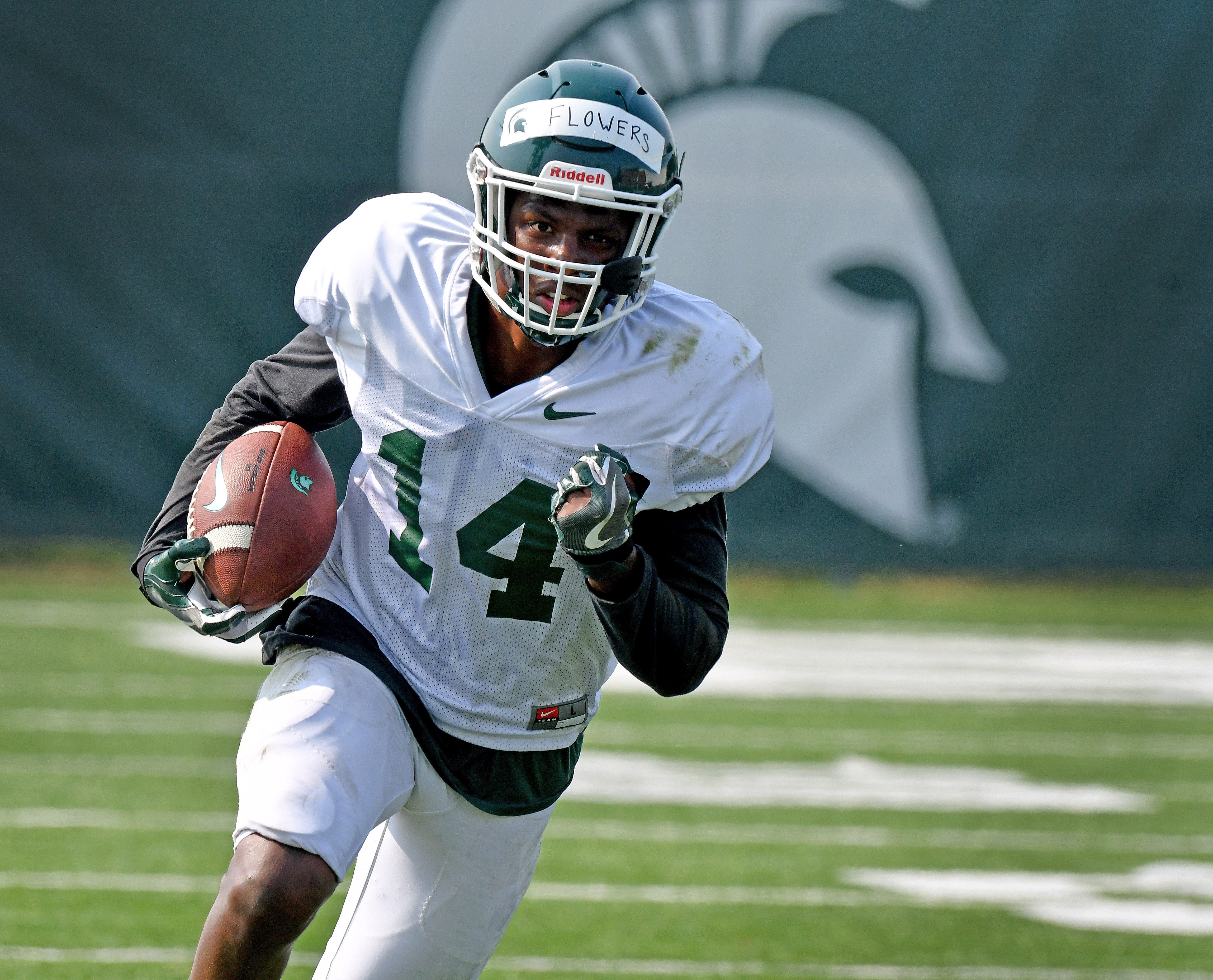 Michigan State receiver Emmanuel Flowers turns upfield with the football.