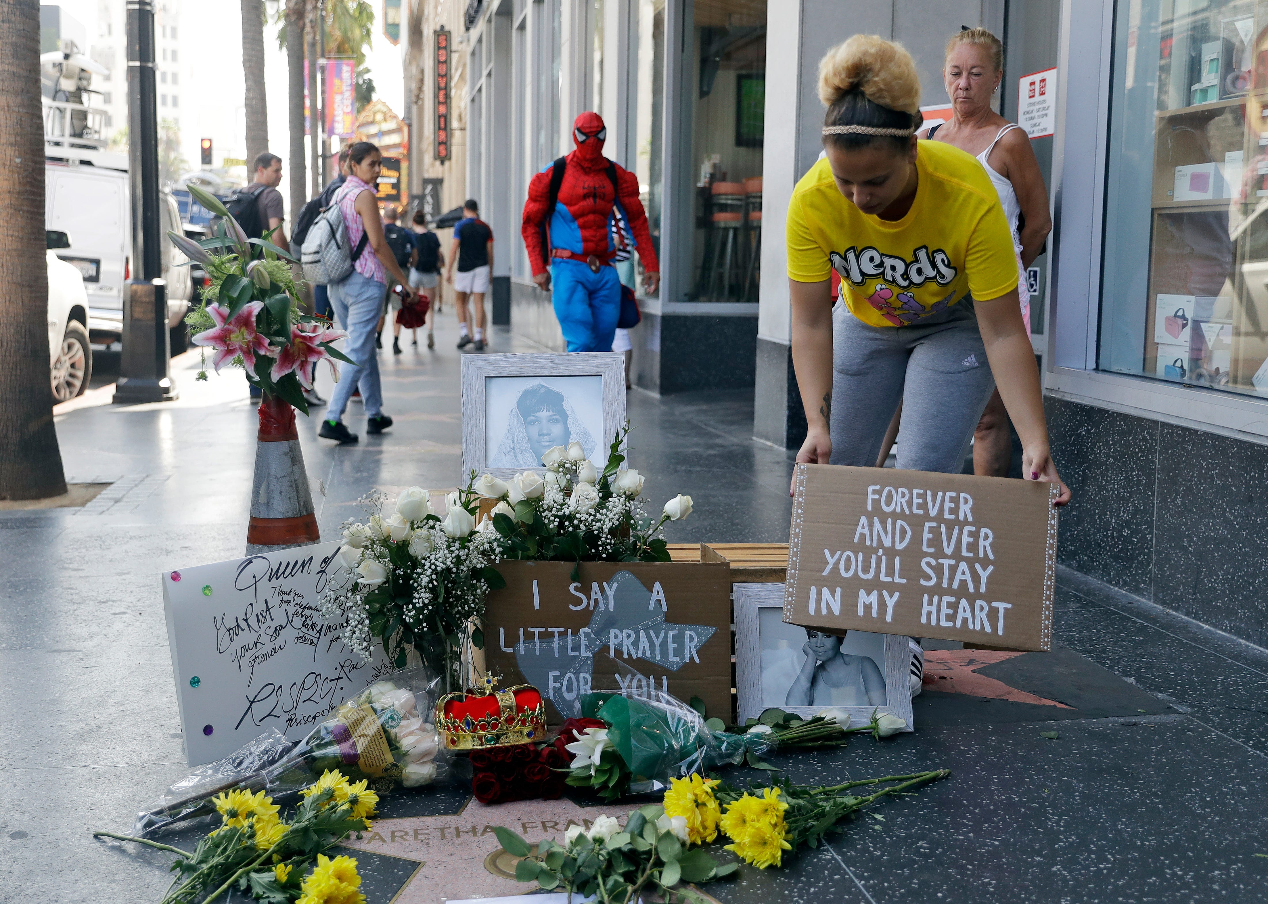 Flowers and signs are placed on Aretha Franklin's star at the Hollywood Walk of Fame, Thursday  in Los Angeles.