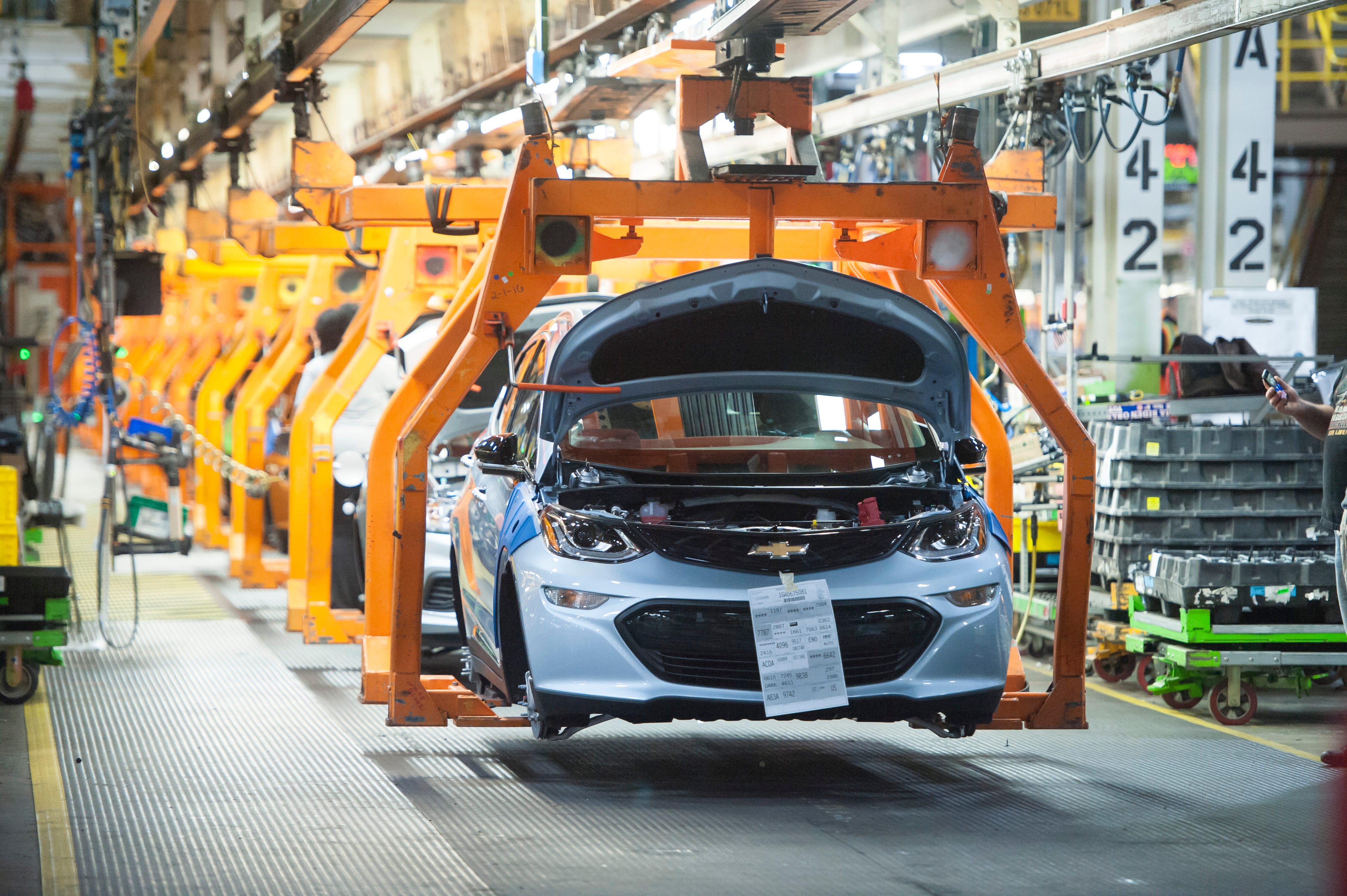 A Chevrolet Bolt EV makes its way down the assembly line at the General Motors assembly plant in Lake Orion.