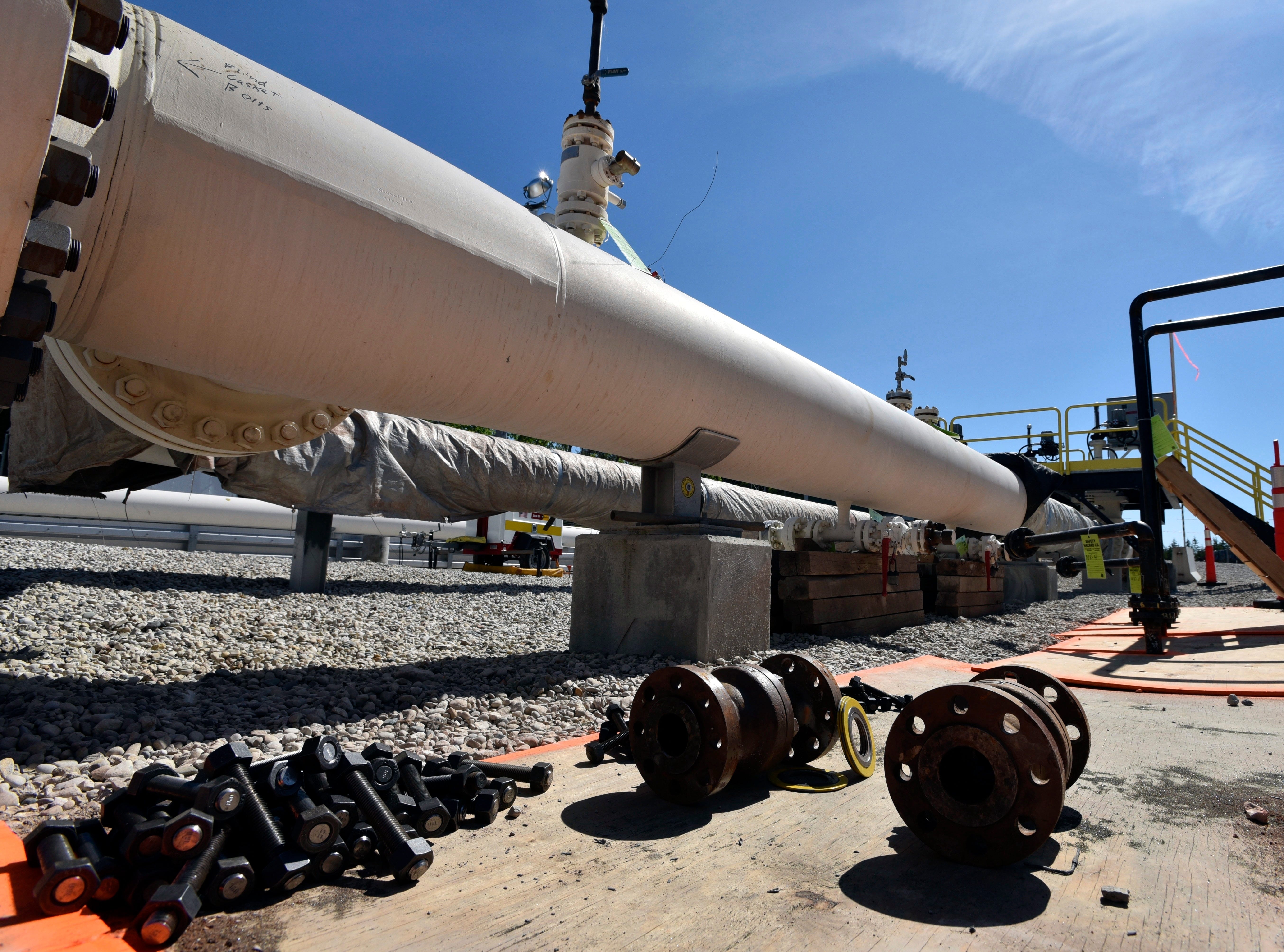 In this 2017 file photo, fresh nuts, bolts and fittings are ready to be added to the east leg of the pipeline near St. Ignace, Mich., as Canadian oil transport company Enbridge prepares to test the east and west sides of the Line 5 pipeline under the Straits of Mackinac.