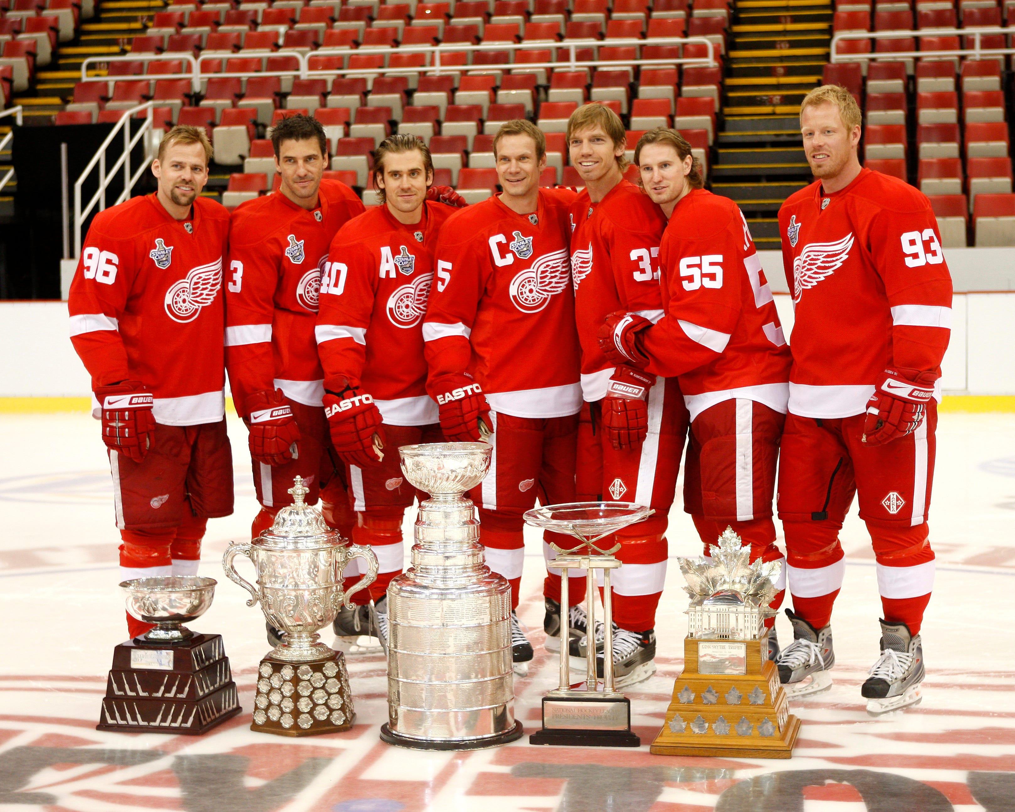 The Swedish contingent of the team pose with the various trophies won throughout the 2008 postseason. From left are Tomas Holmstrom, Andreas Lilja, Henrik Zetterberg, Nicklas Lidstrom, Mikael Samuelsson, Niklas Kronwall, and Johan Franzen