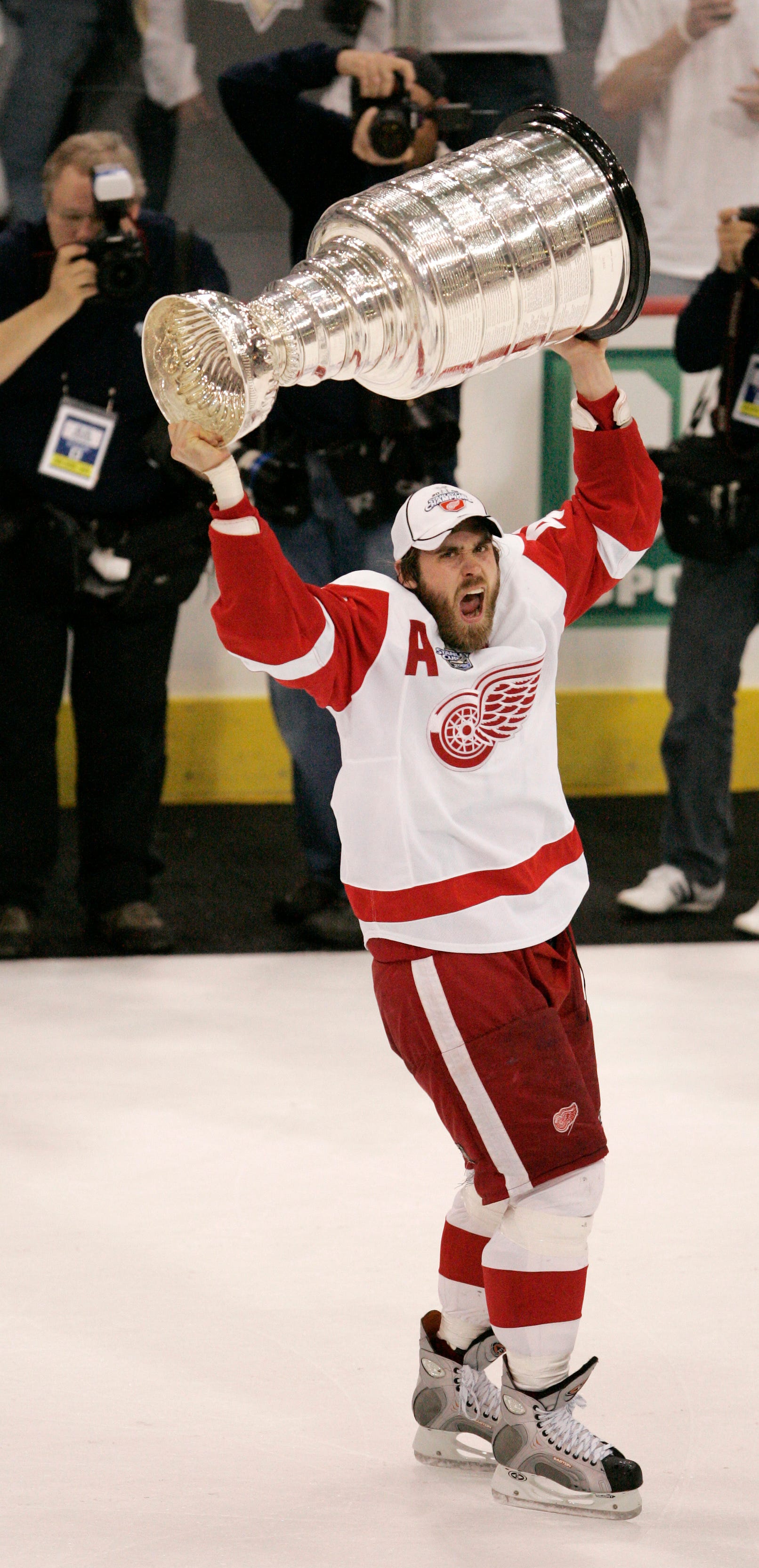 Playoff MVP Henrik Zetterberg lifts the 2008 Stanley Cup after the final buzzer of a 3-2 Cup-clinching victory over the Pittsburgh Penguins. The Red Wings won the series 4-2.