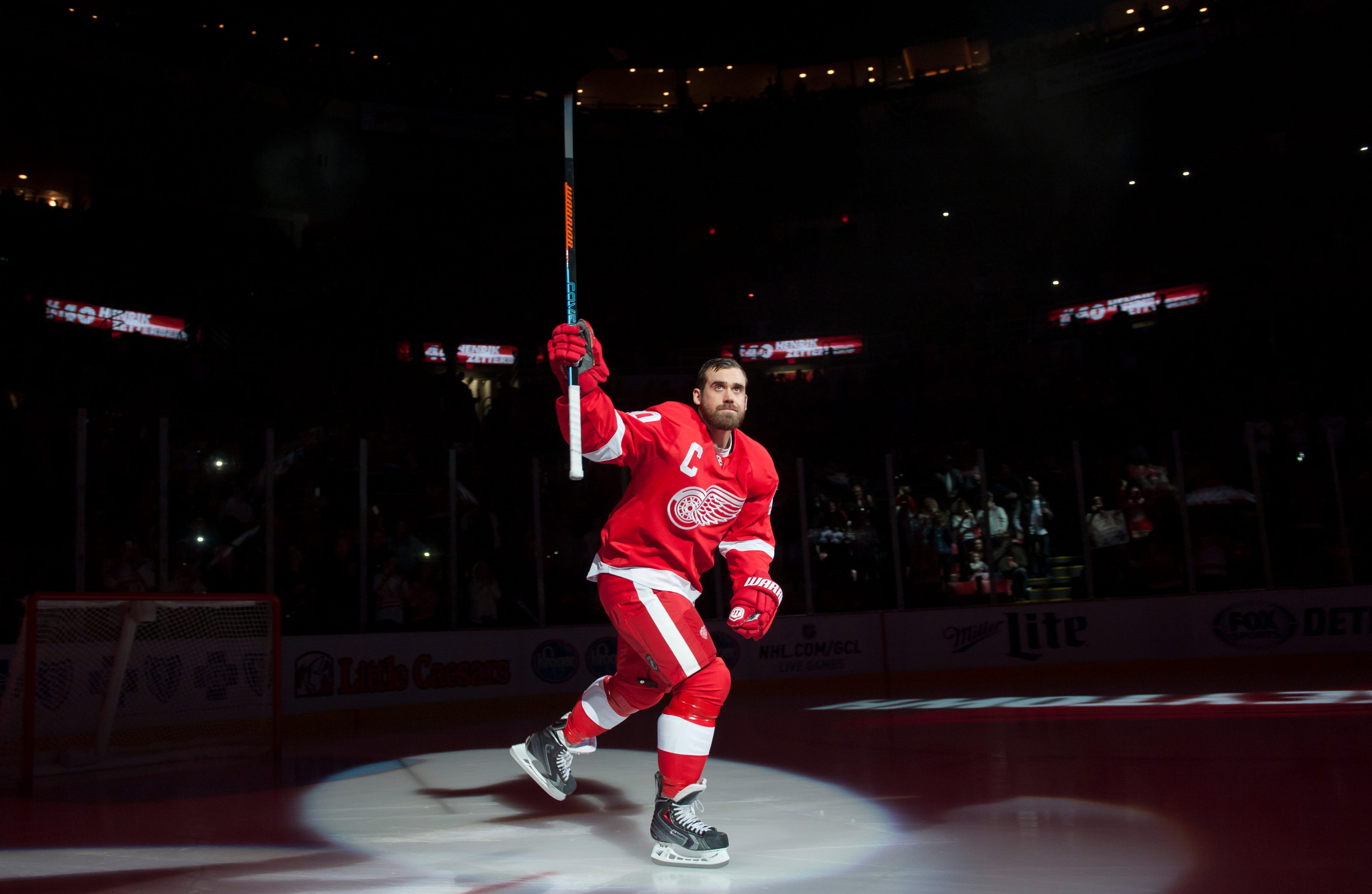 Detroit Red Wings left wing Henrik Zetterberg skates onto the ice for pre-game introductions before the start a game against the Boston Bruins at Joe Louis Arena on Oct. 9, 2014.