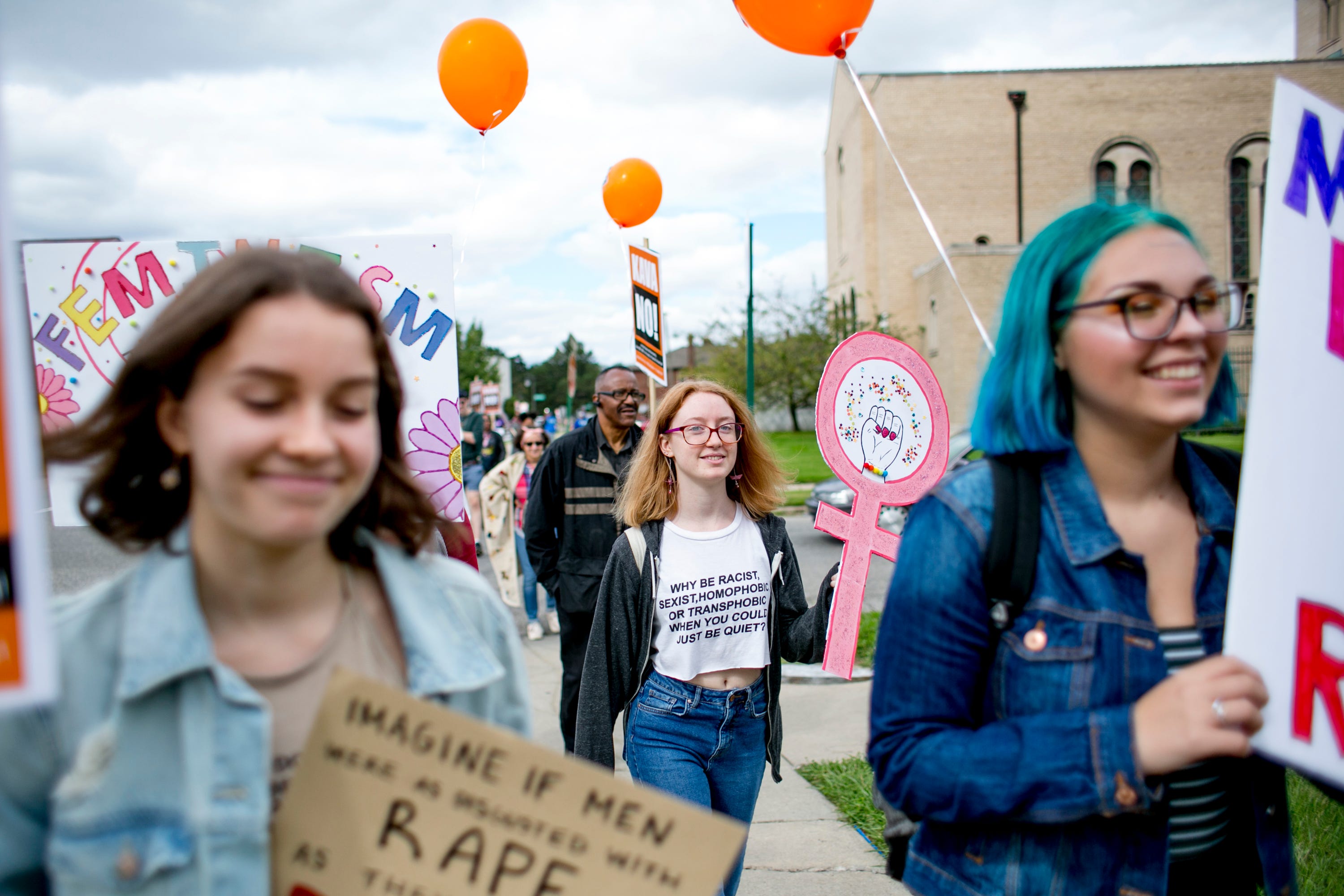 Alyssa Johnston, 18, of Warren walks down the street during the Slut Walk near Palmer Park in Detroit on September 22, 2018.  The march and rally brought out about 70 demonstrators protesting sexual violence and other forms of aggression against woman.