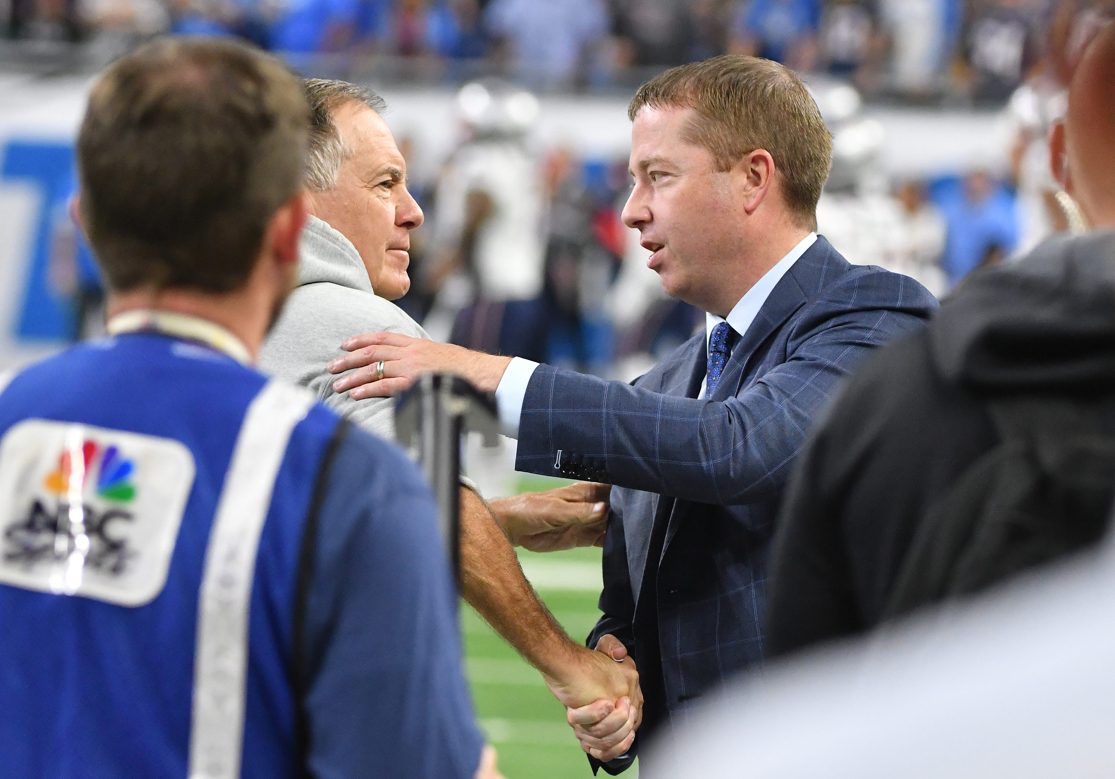 Patriots head coach Bill Belichick shakes hands with Lions GM Bob Quinn during warm-ups.