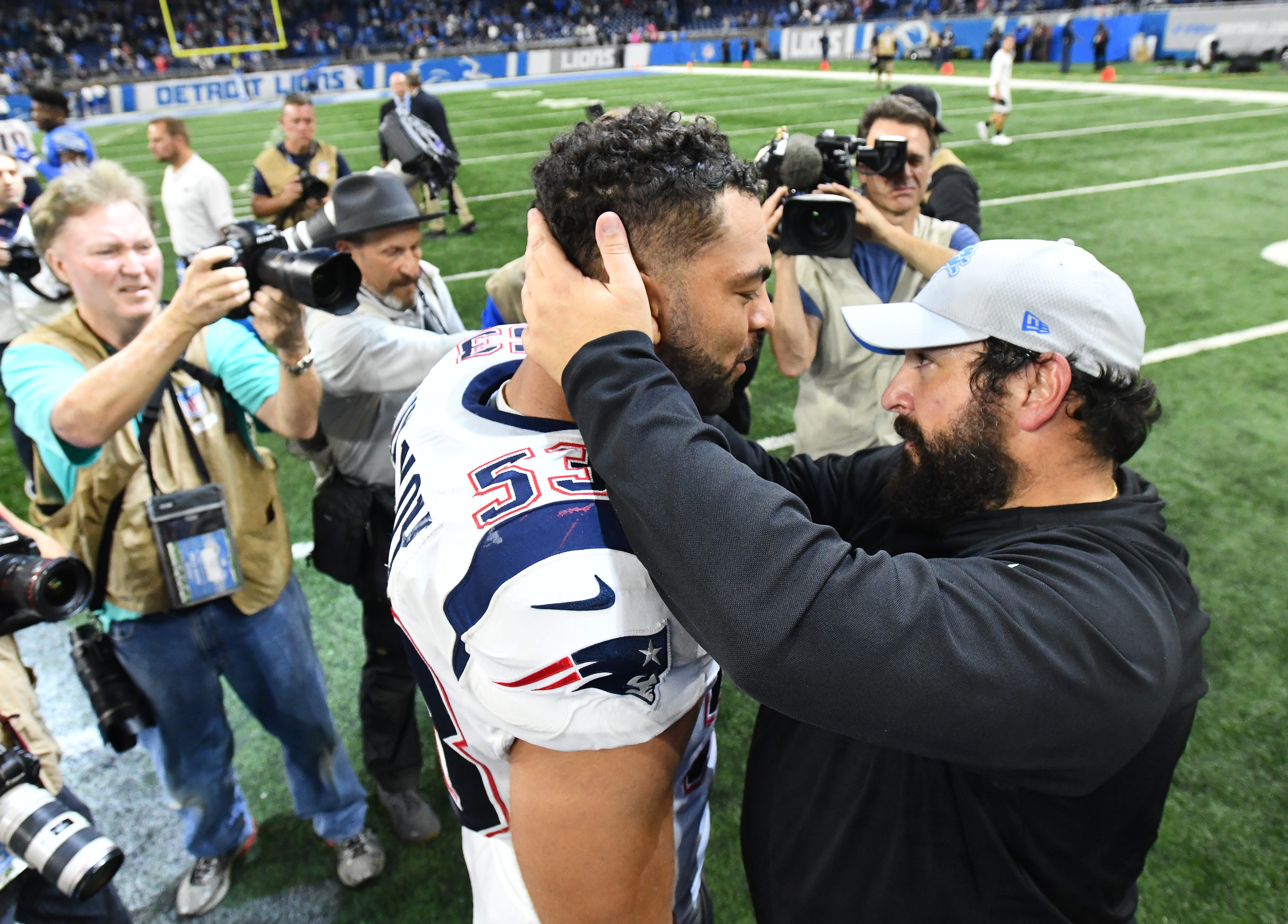 Former Detroit Lion Kyle Van Noy hugs his former New England coach, now head coach with the Lions, Matt Patricia after the Detroit victory.