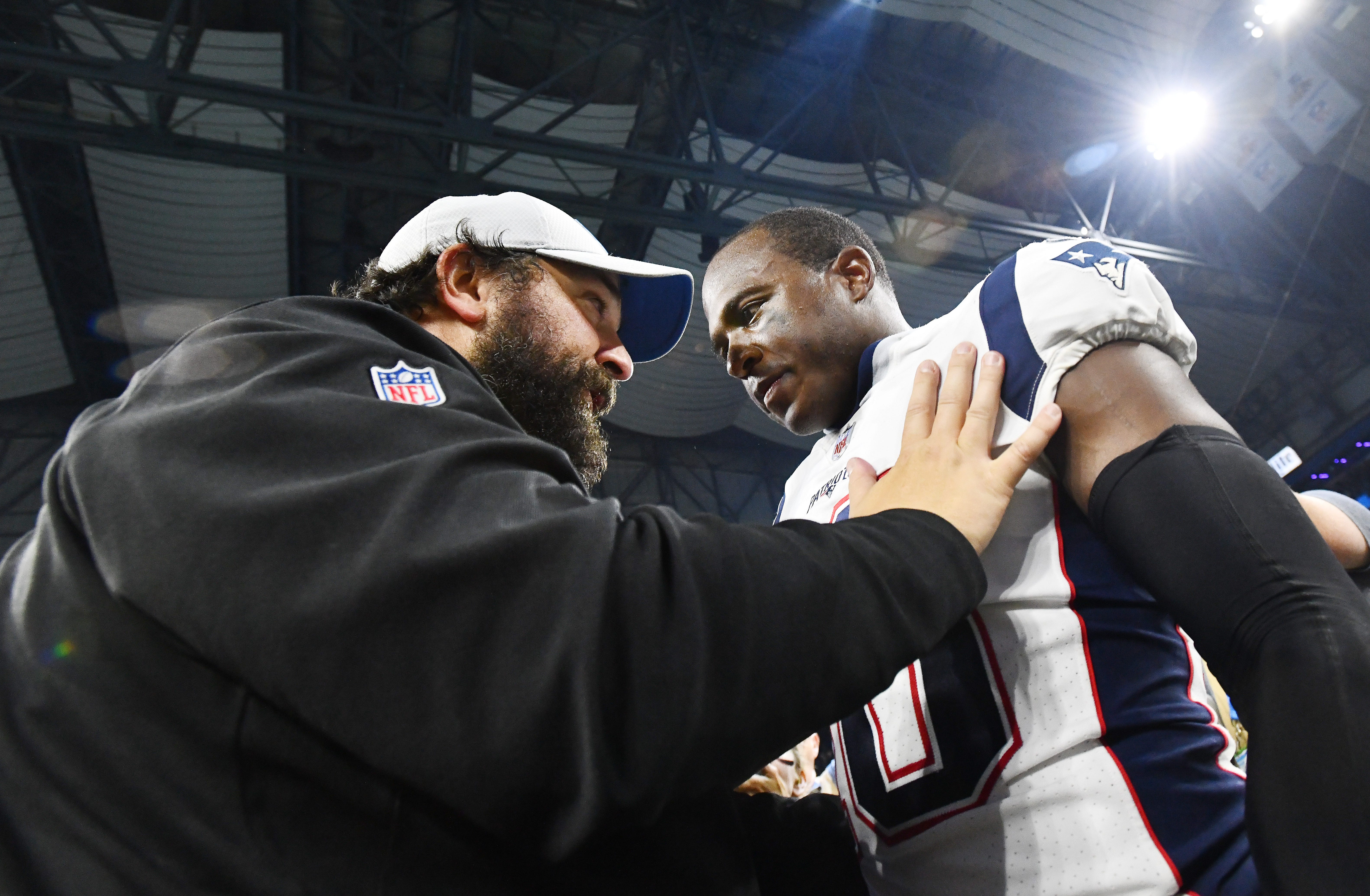 Lions head coach Matt Patricia talks with one of his former players, Patriots ' Matthew Slater, after the Detroit victory.