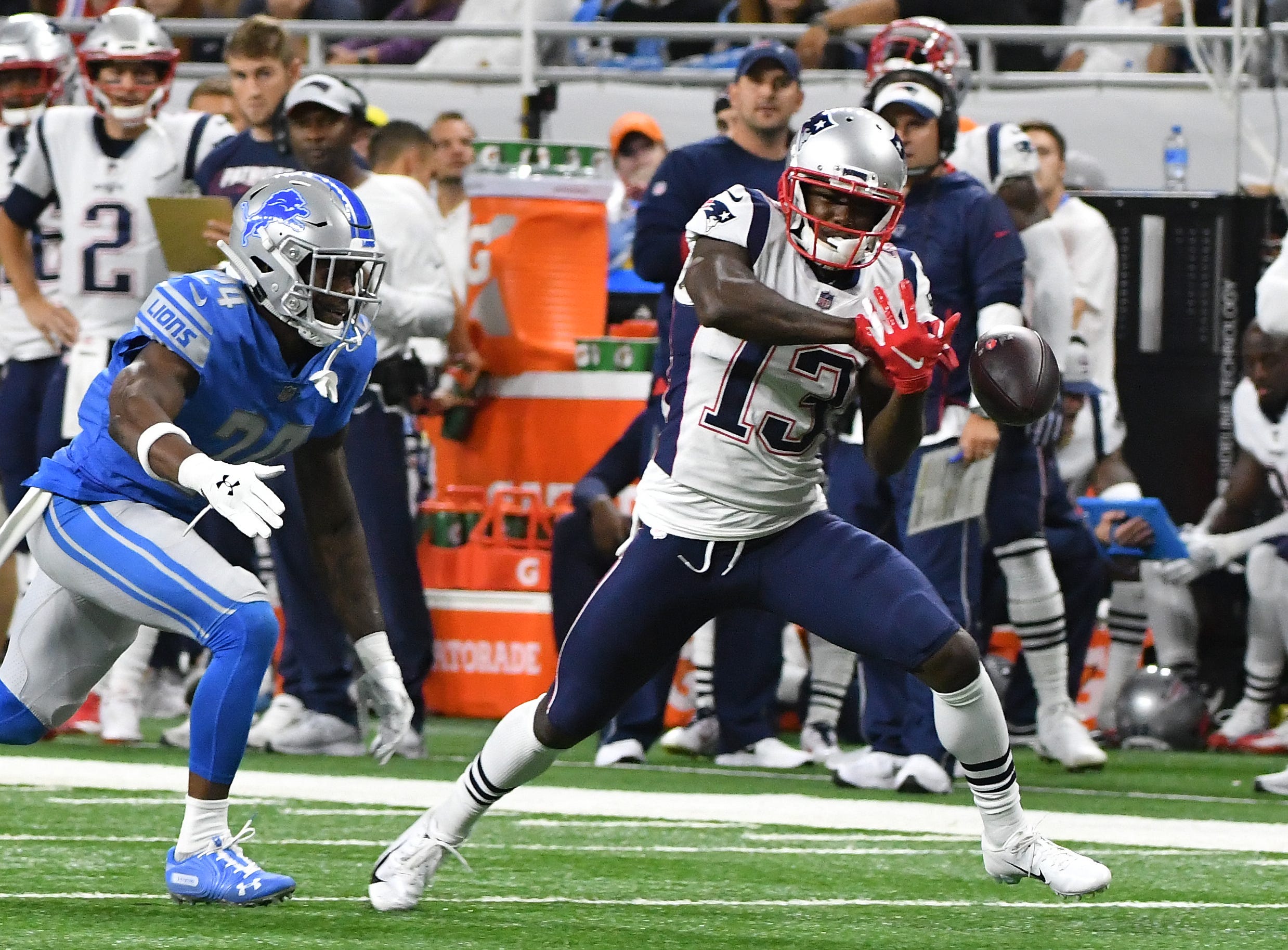 Patriots ' Phillip Dorsett can ' t hang onto a pass that hits his hands with Lions corner back Kevin Lawson defending int he first quarter.