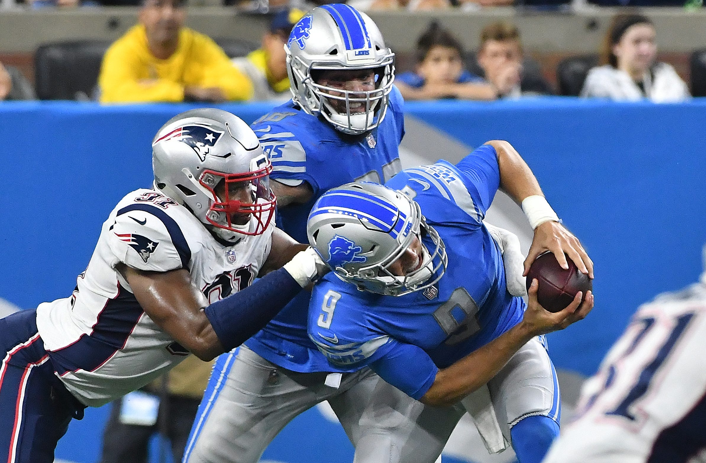 Patriots ' Deatrich Wise Jr. gets under Lions offensive lineman Taylor Decker and sacks quarterback Matthew Stafford in the third quarter.