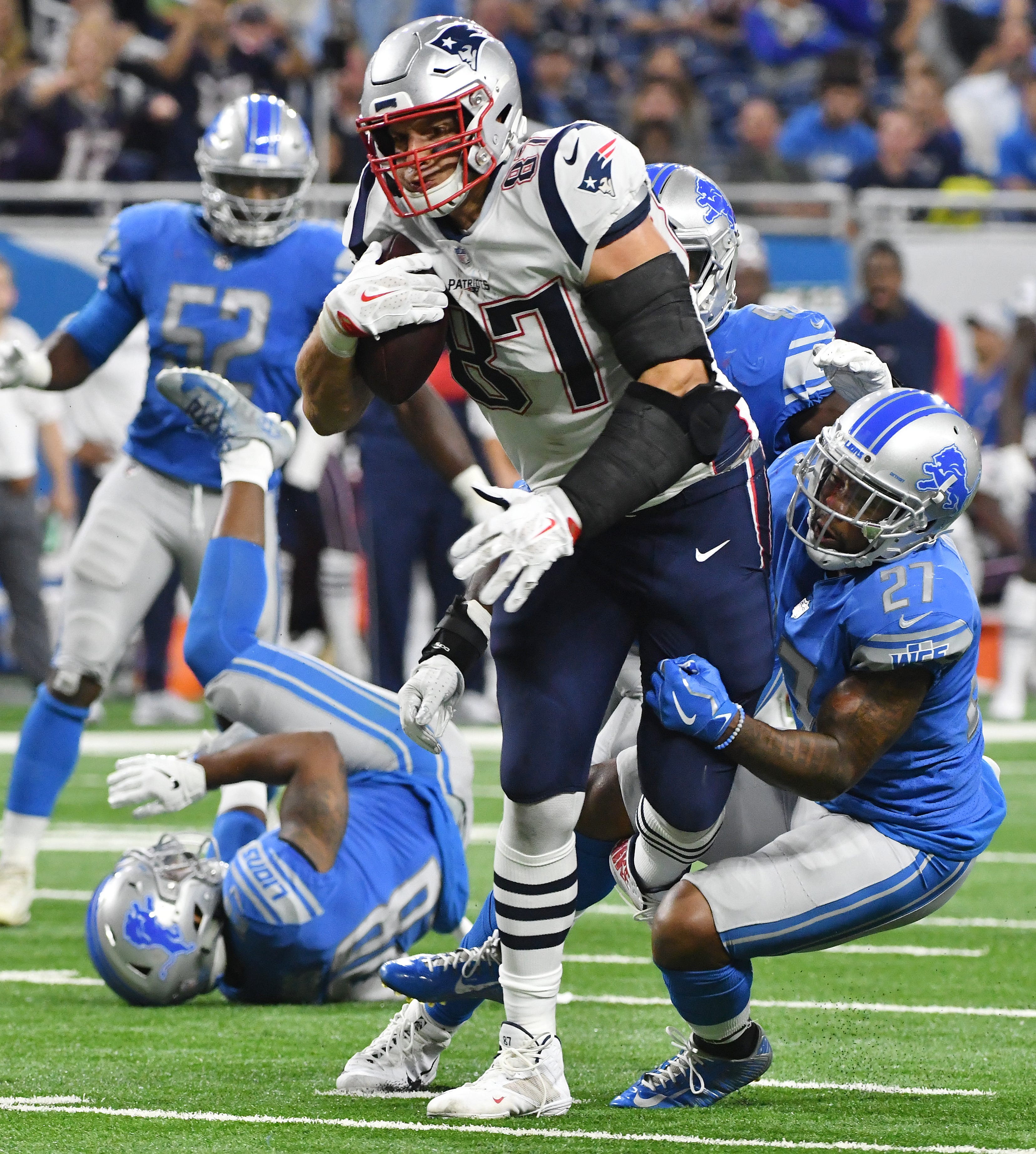 Patriots tight end Rob Gronkowski continues upfield after a reception leaving a wake of Lions defenders in his wake in the third quarter.