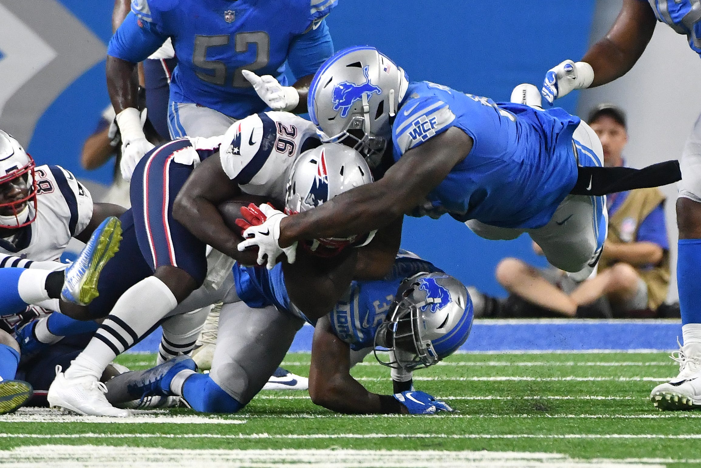 Lions Tavon Wilson and A ' Shawn Robinson stop Patriots ' Sony Michel from making a first down on third-and-1 in the second quarter.