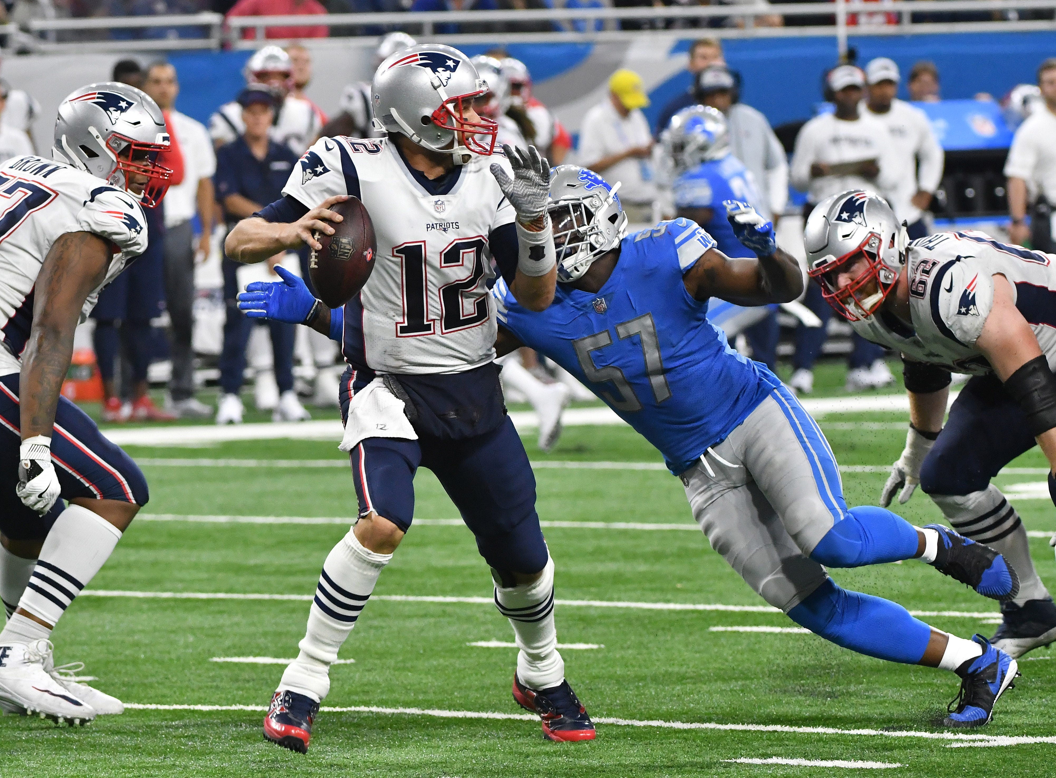 Patriots ' Tom Brady is sacked by Lions ' Eli Harold in the fourth quarter.