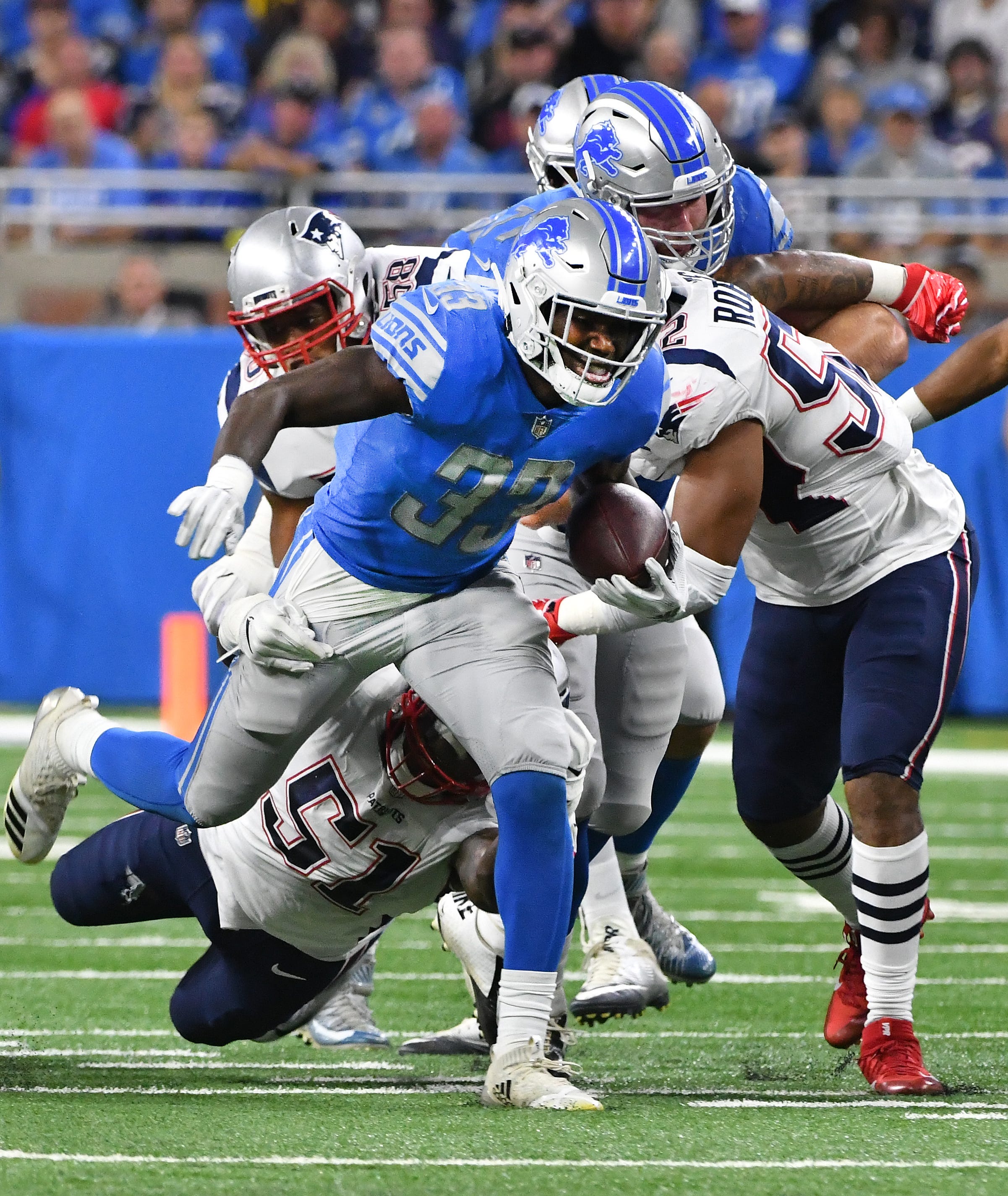 Lions running back Kerryon Johnson breaks up field for a first-down run in the first quarter.