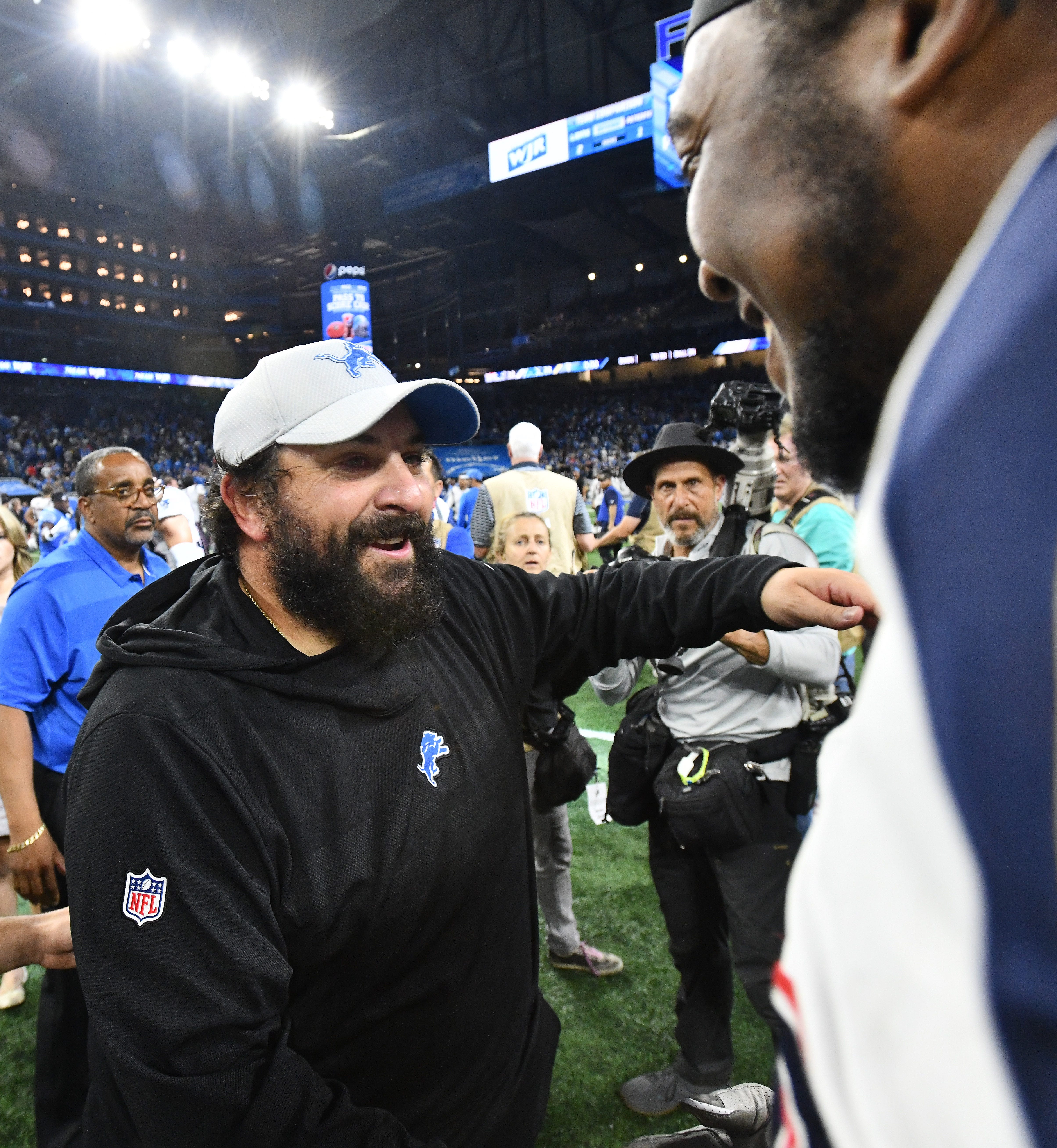 Lions head coach Matt Patricia hugs one of his former players, Patriots ' Adam Butler after the Detroit victory