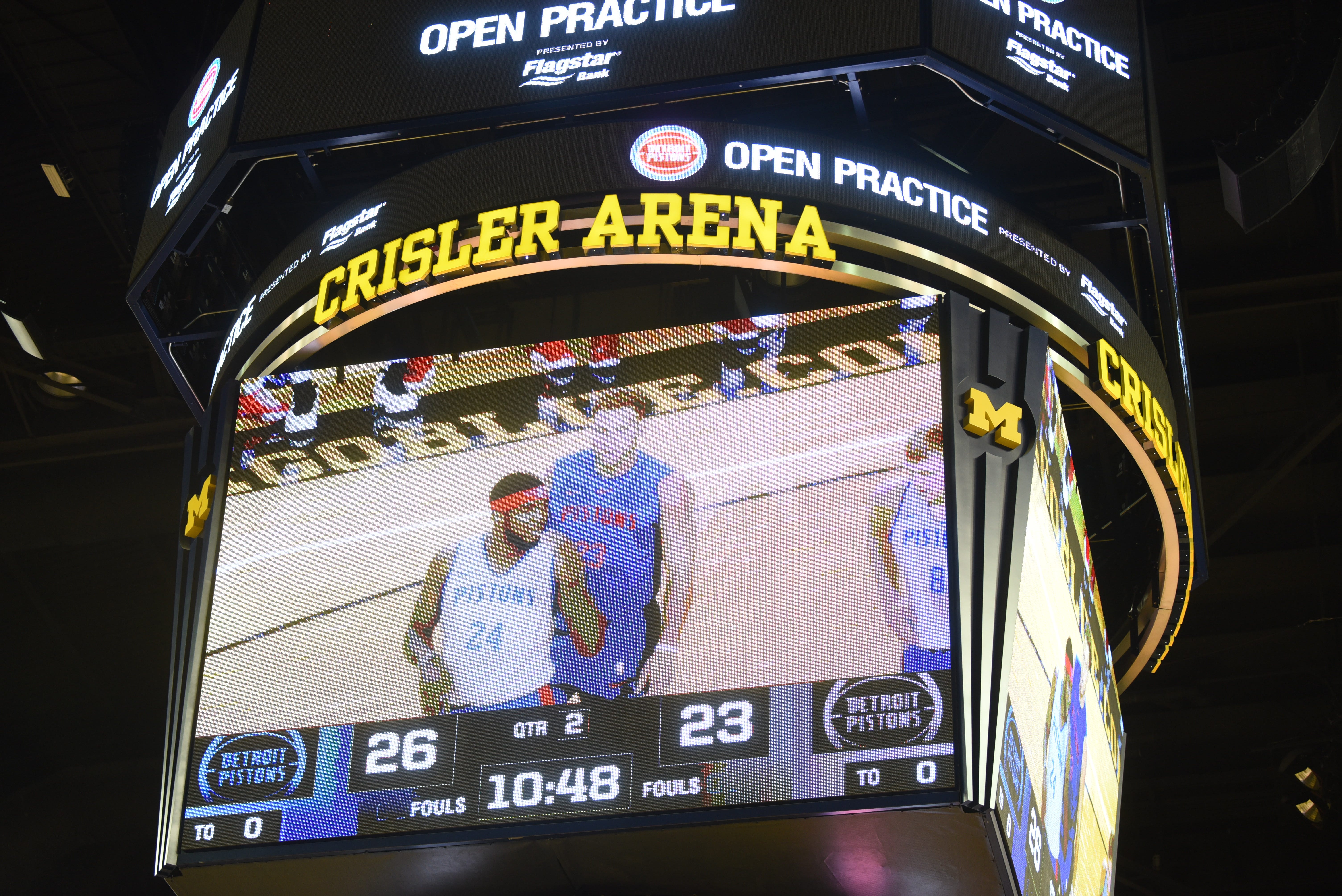 Pistons are shown on the big screen during open practice at Crisler Center.