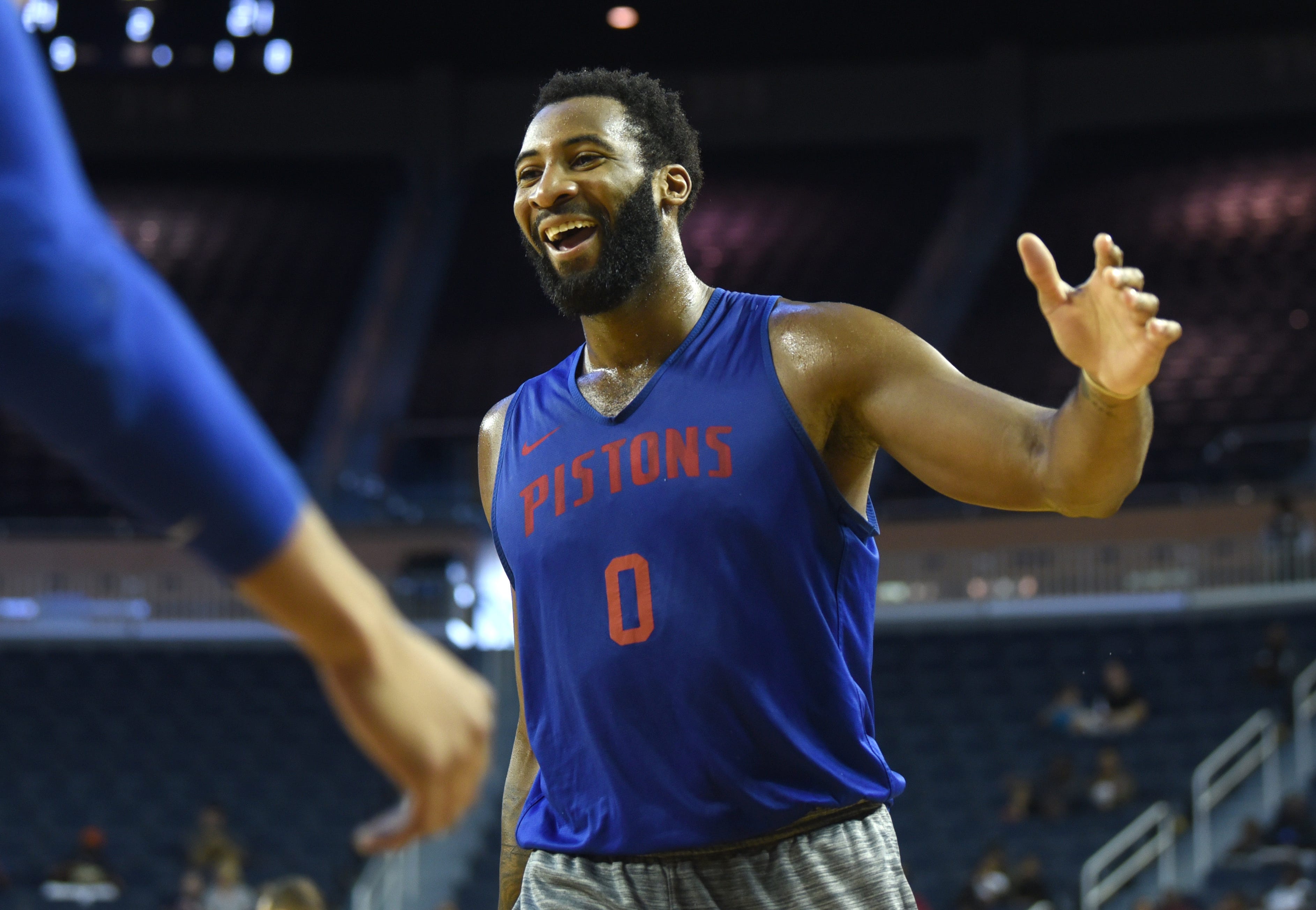 Pistons star Andre Drummond reacts in jubilation during open practice.