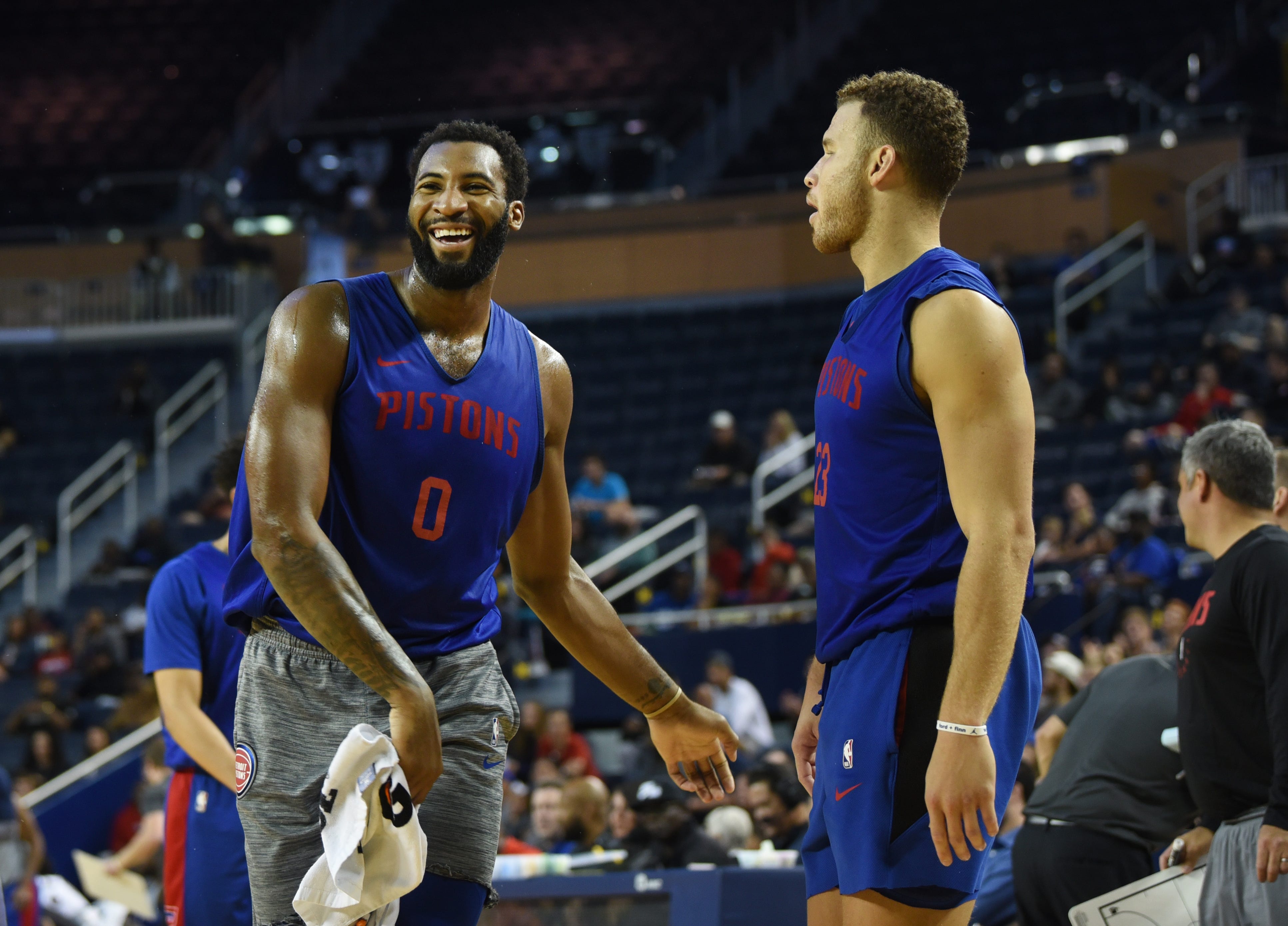 Andre Drummond shares a moment with Blake Griffin during an open practice.