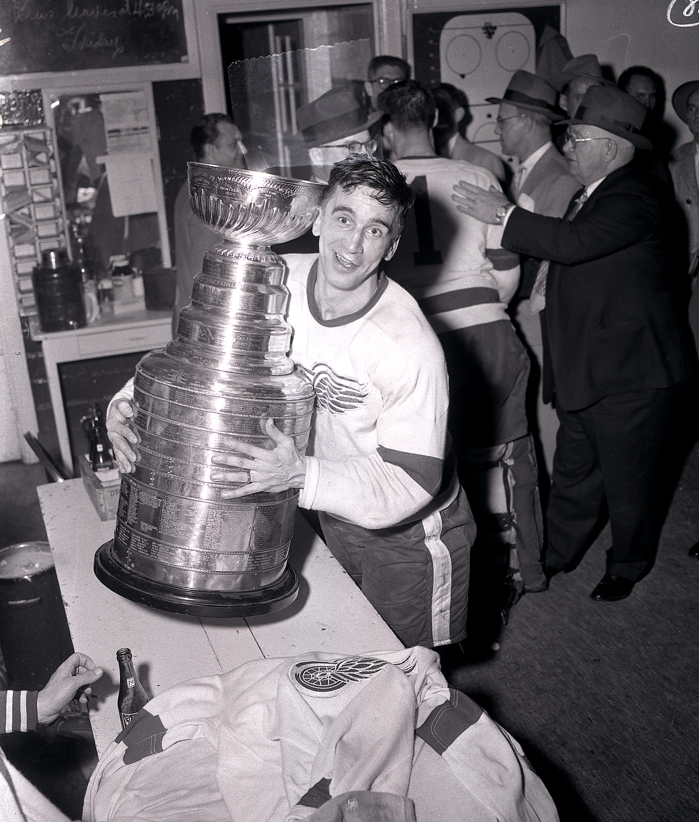 Ted Lindsay's Red Wings won the Stanley Cup in 1950, 1952, 1954 and 1955. Lindsay was the first player to lift the Stanley Cup and skate it around the rink, starting the tradition.[