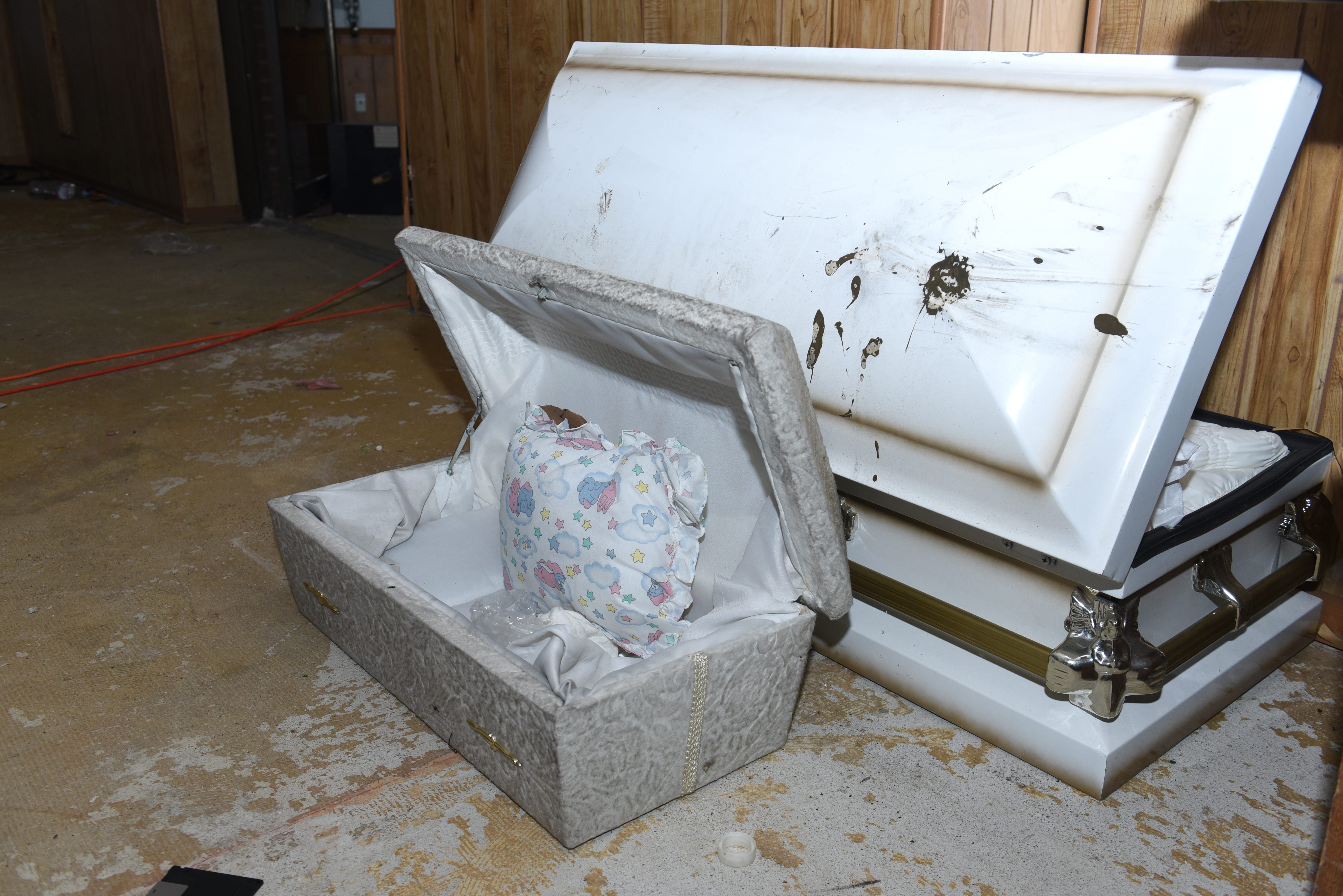 The small casket where some of the remains of the 11 infants were found  hidden in a ceiling compartment were still inside the former Cantrell Funeral Home on Saturday.