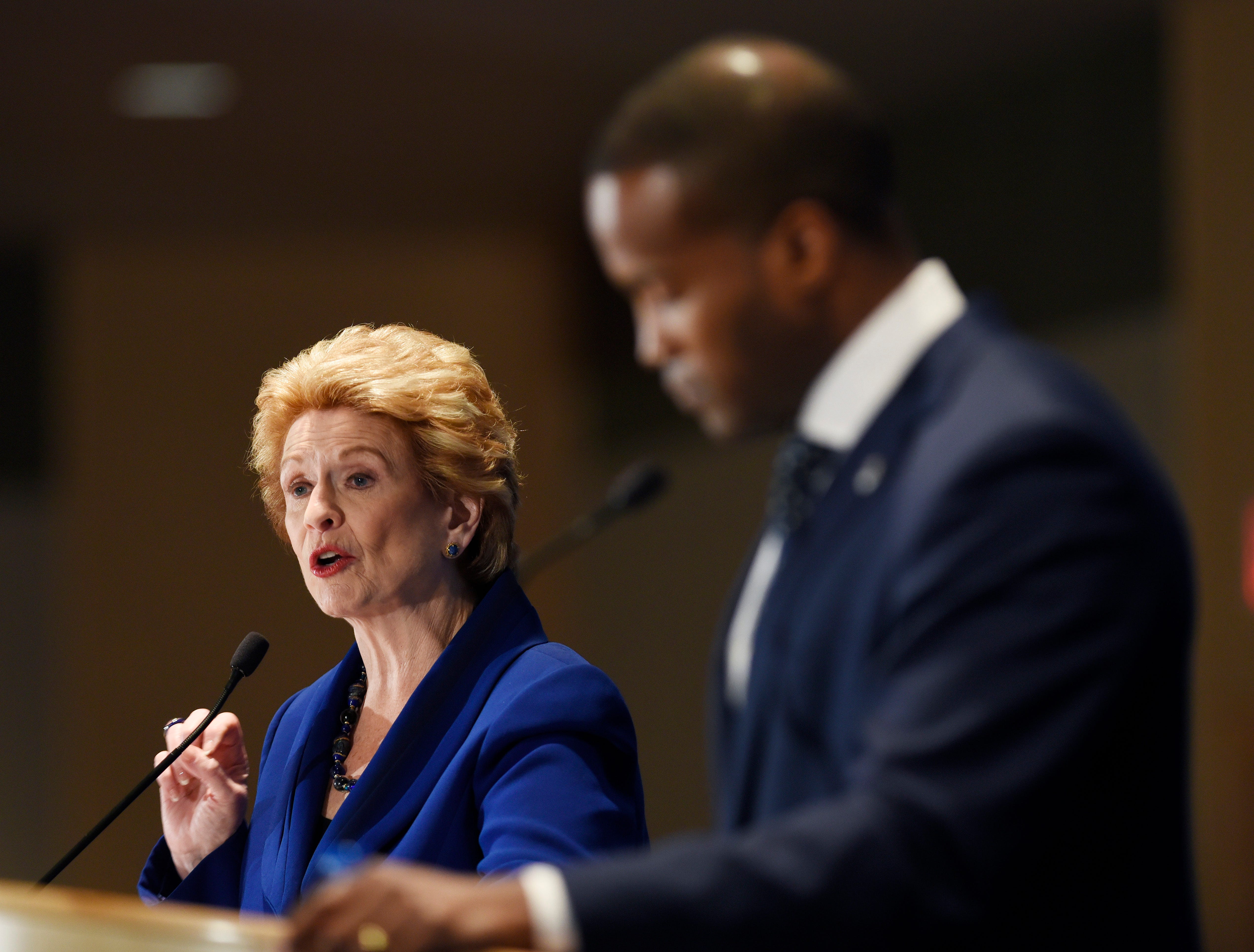 U.S. Sen Debbie Stabenow,  speaks while her Republican challenger John James waits for his turn during their debate Monday before the Detroit Economic Club in 2018.