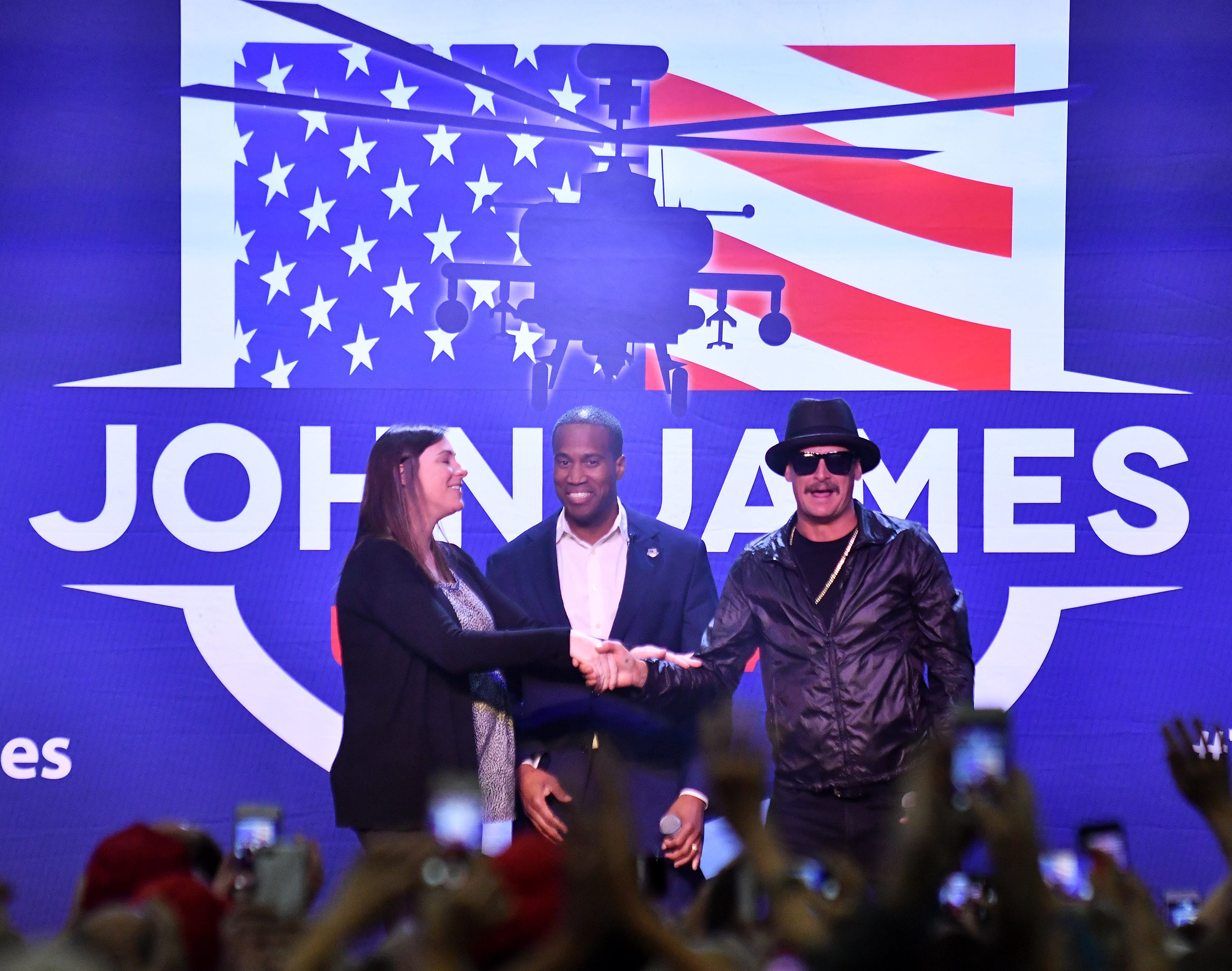 Kid Rock introduces John James and his wife Elizabeth, left, during the rally.