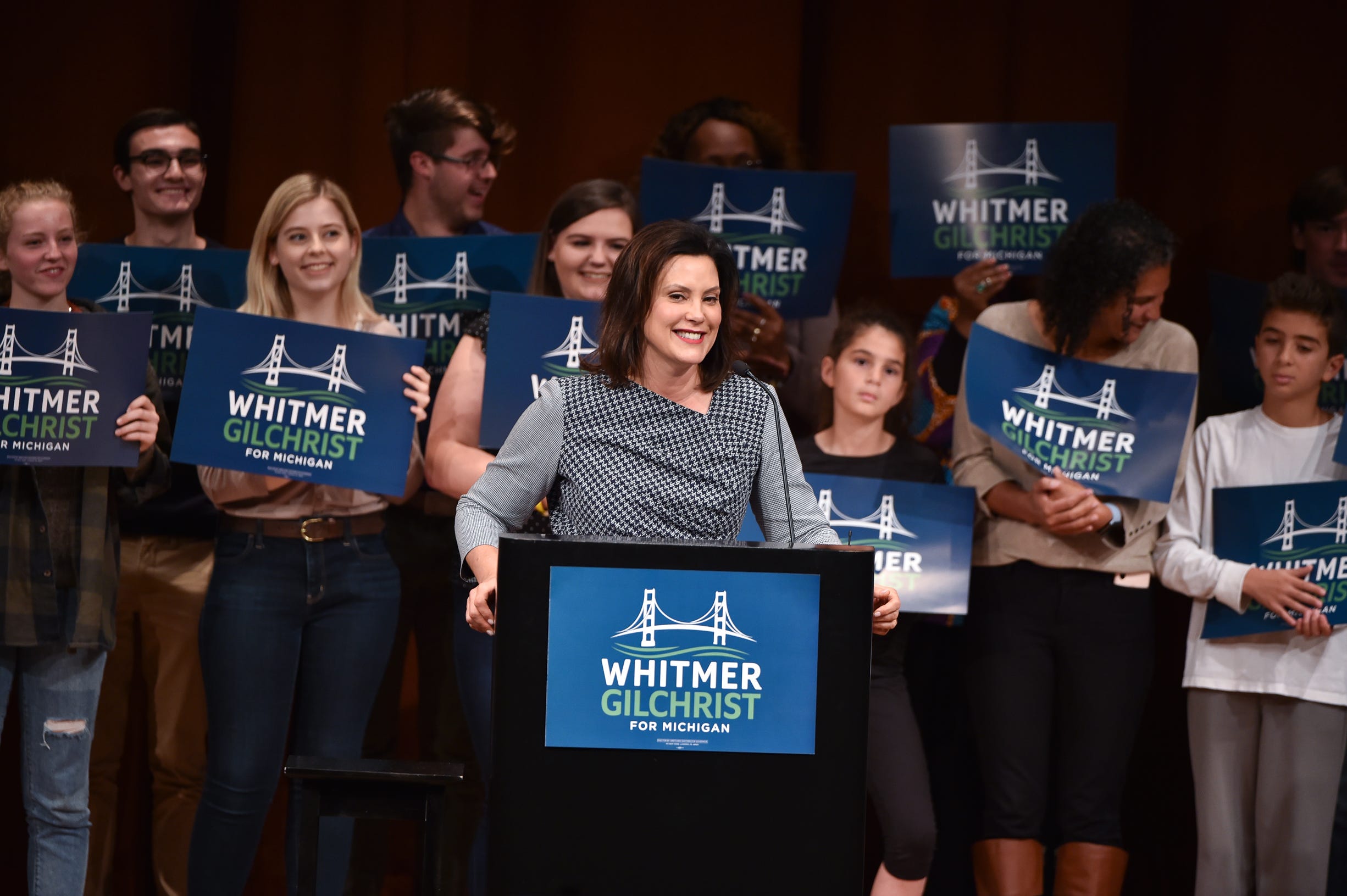 Michigan gubernatorial candidate Gretchen Whitmer smiles at the applause of the crowd in Rackham Auditorium in Ann Arbor.