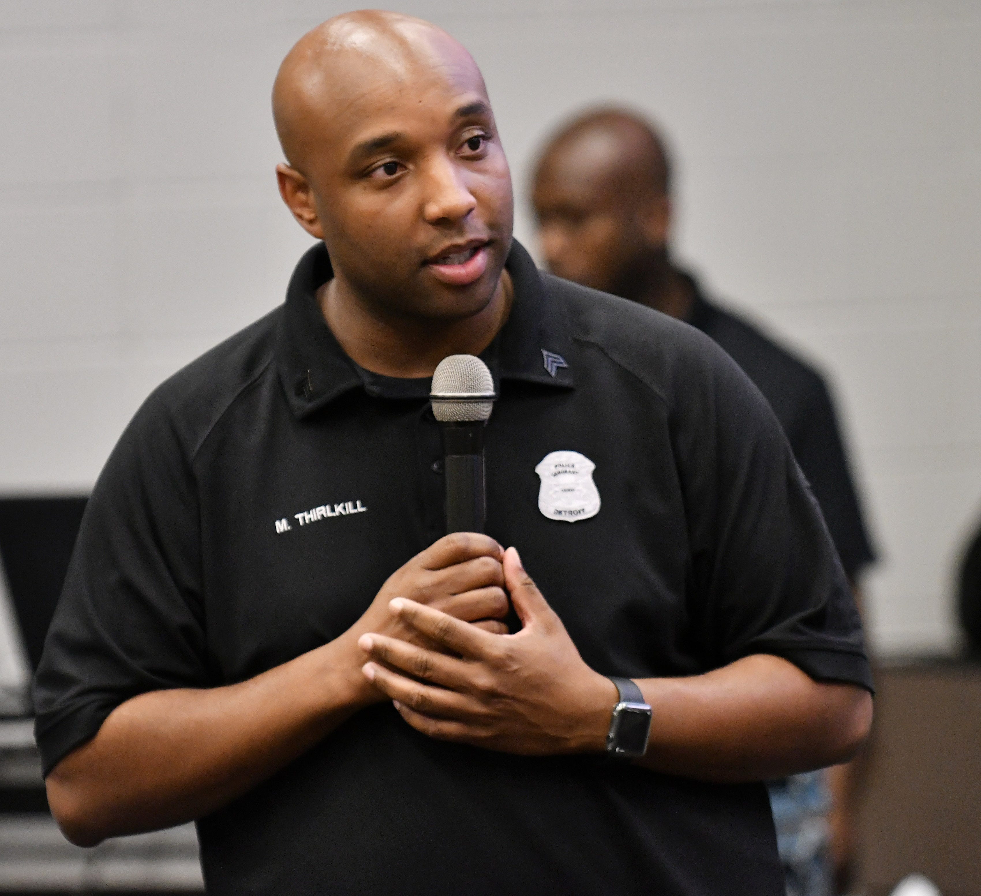 Detroit police Sgt. Marcus Thirlkill welcomes the young men during a Cuts and Coding educational event for young black males at the Ford Research and Engagement Center on Maddelein Street in Detroit on Aug. 9, 2018. This is one week of an ongoing project with Detroit police Sgt. Marcus Thirlkill and some of his co-workers who meet with the young men each week doing various mentorship programs.