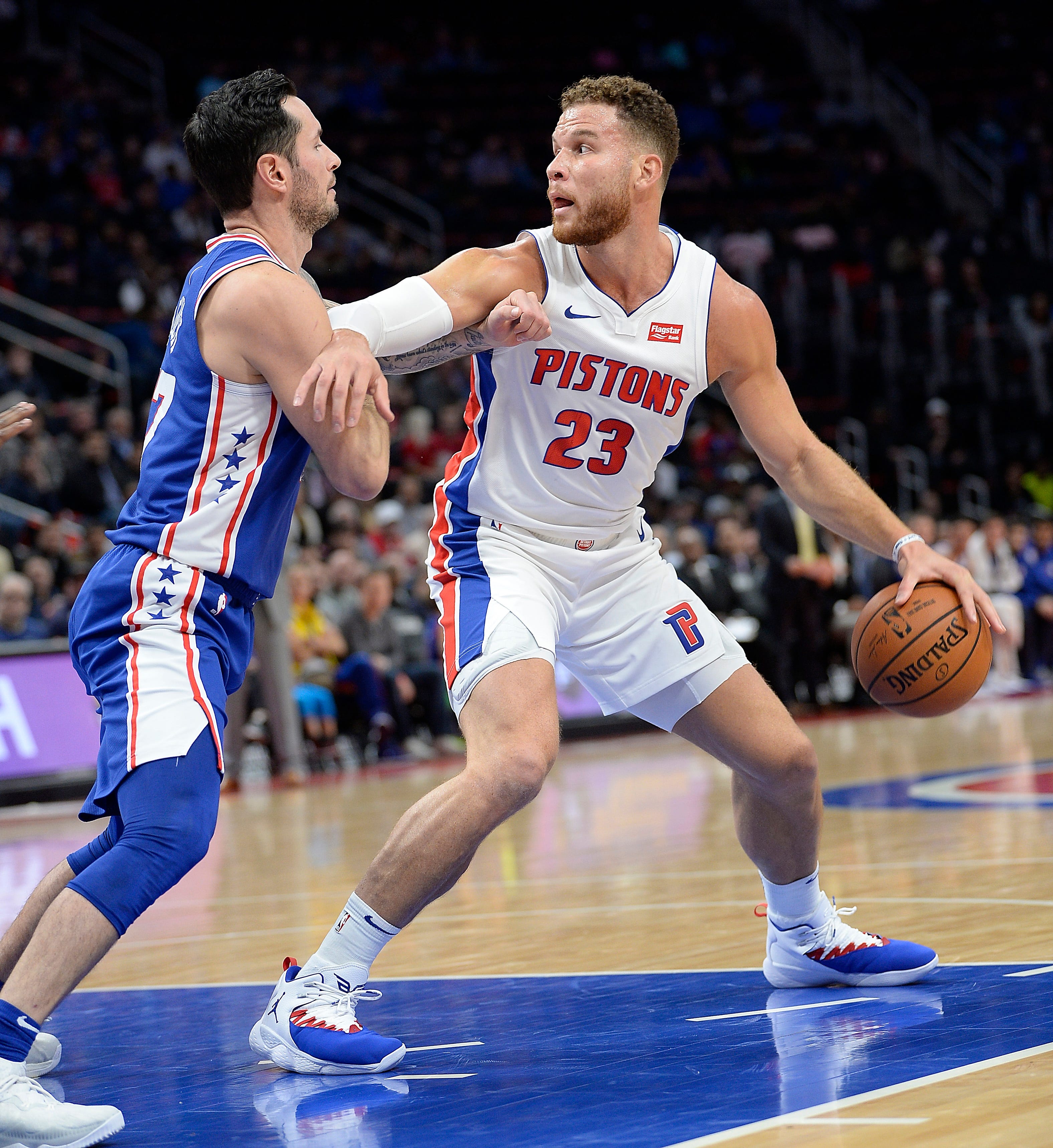 Pistons' Blake Griffin looks for room around 76ers' JJ Redick. Griffin finished with 50 points, including the winning three-point play.
