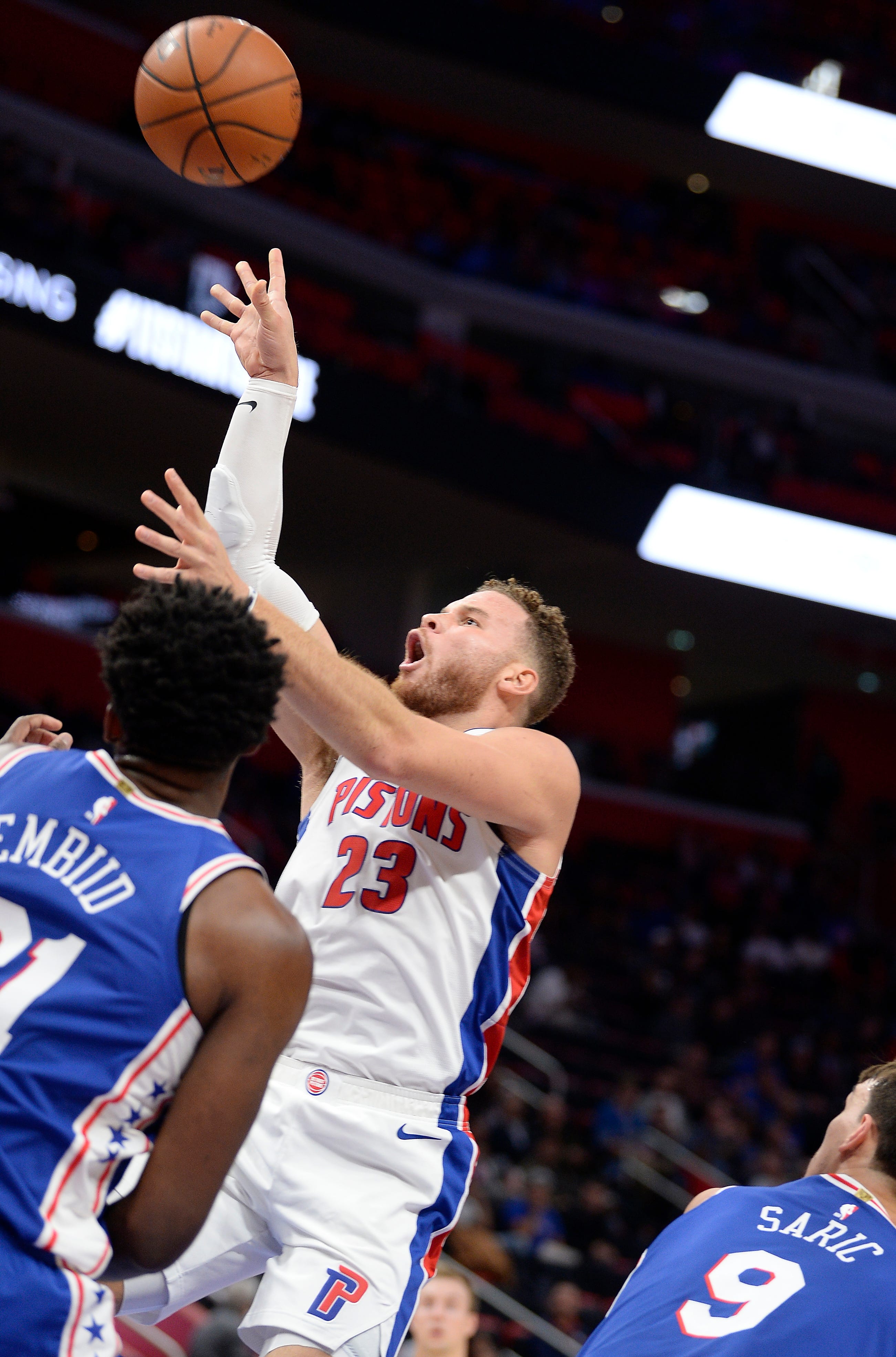 Pistons' Blake Griffin scores over 76ers' Joel Embiid in the second quarter.