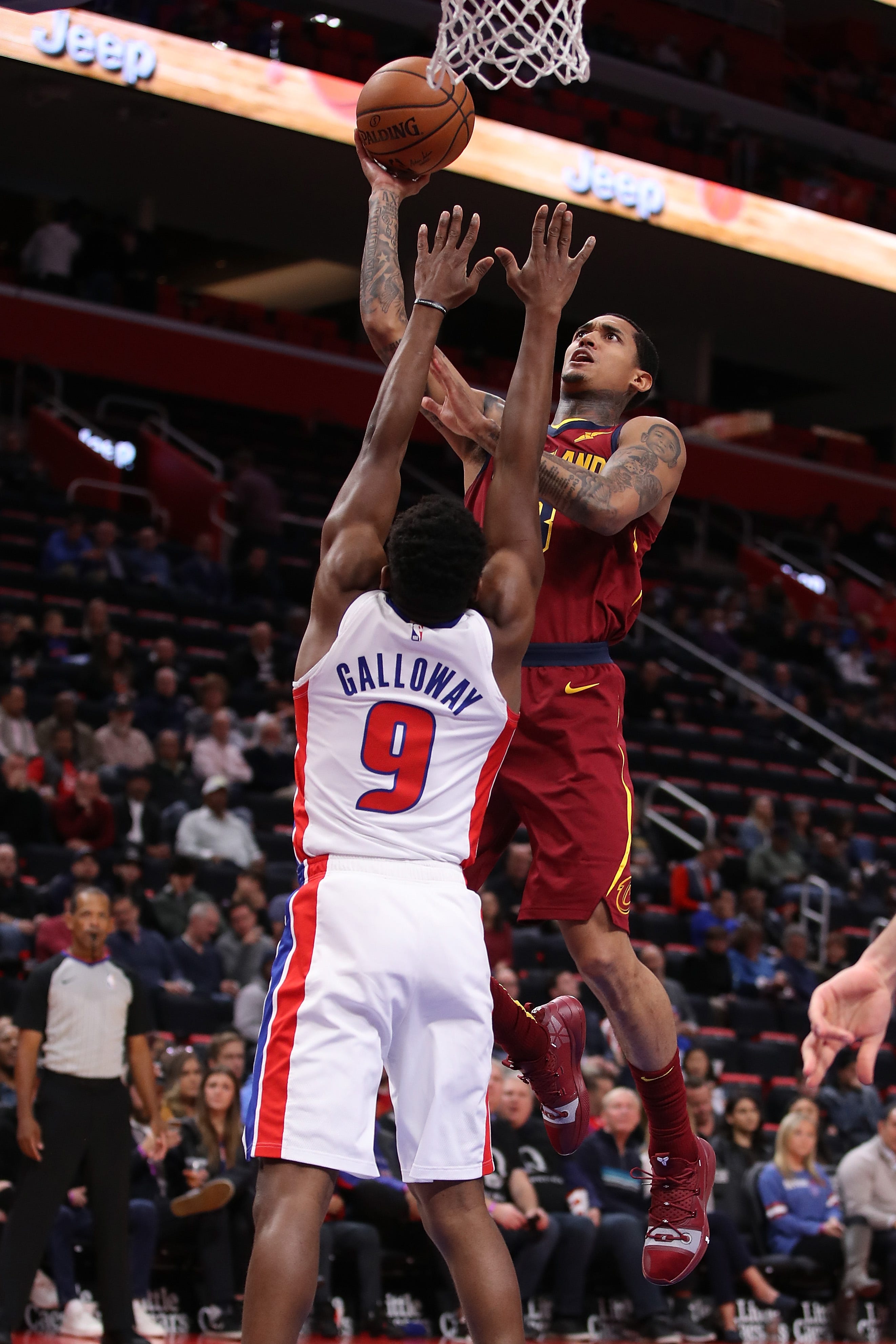 Larry Nance Jr. (22) of the Cleveland Cavaliers takes a shot over Langston Galloway (9) of the Detroit Pistons during the first half.