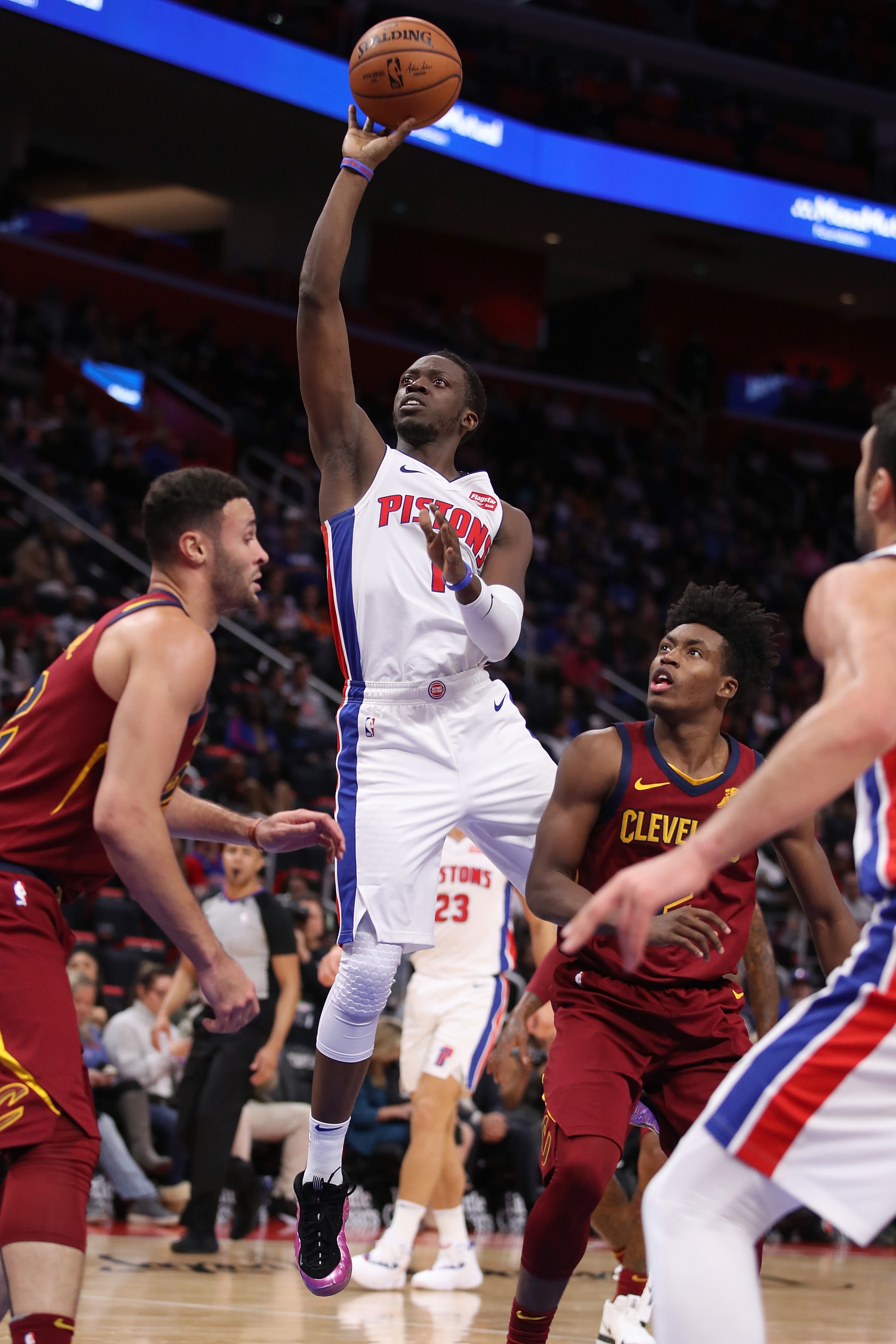 Reggie Jackson (1) of the Detroit Pistons takes a shot in front of Collin Sexton (2) of the Cleveland Cavaliers during the second half.