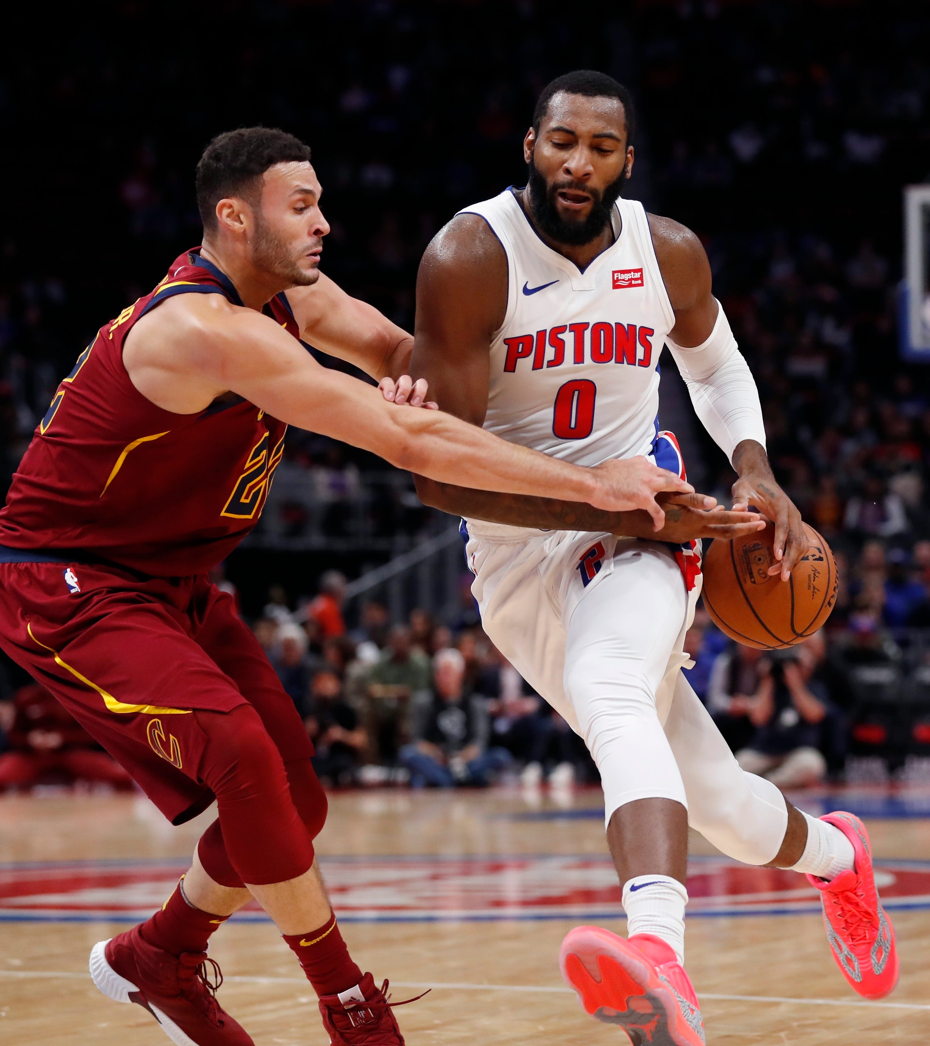 Cleveland Cavaliers forward Larry Nance Jr. (22) knocks the ball away from Detroit Pistons center Andre Drummond (0) during the first half.