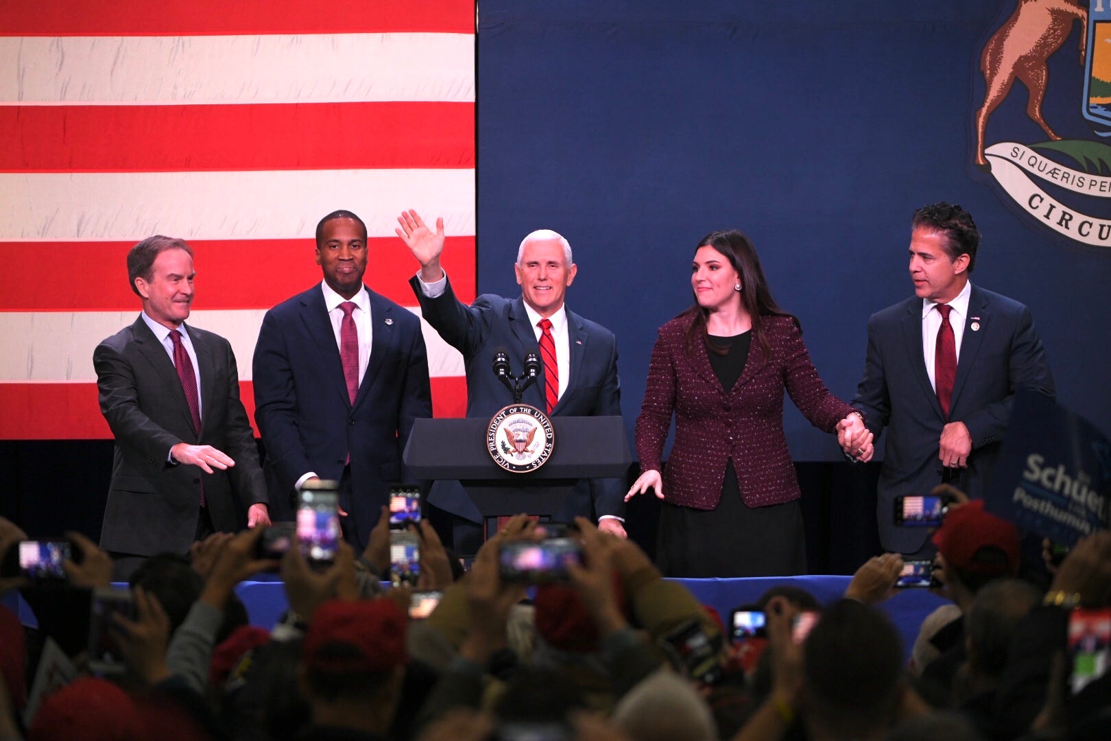 Michigan attorney general and Republican gubernatorial candidate Bill Schuette, from left, U.S. Senate candidate John James, Vice President Mike Pence, congressional candidate Lena Epstein and incumbent and candidate for re-election U.S. Rep. Mike Bishop, R-Rochester, stand together on stage during a campaign event at the Oakland County airport Monday in Waterford.