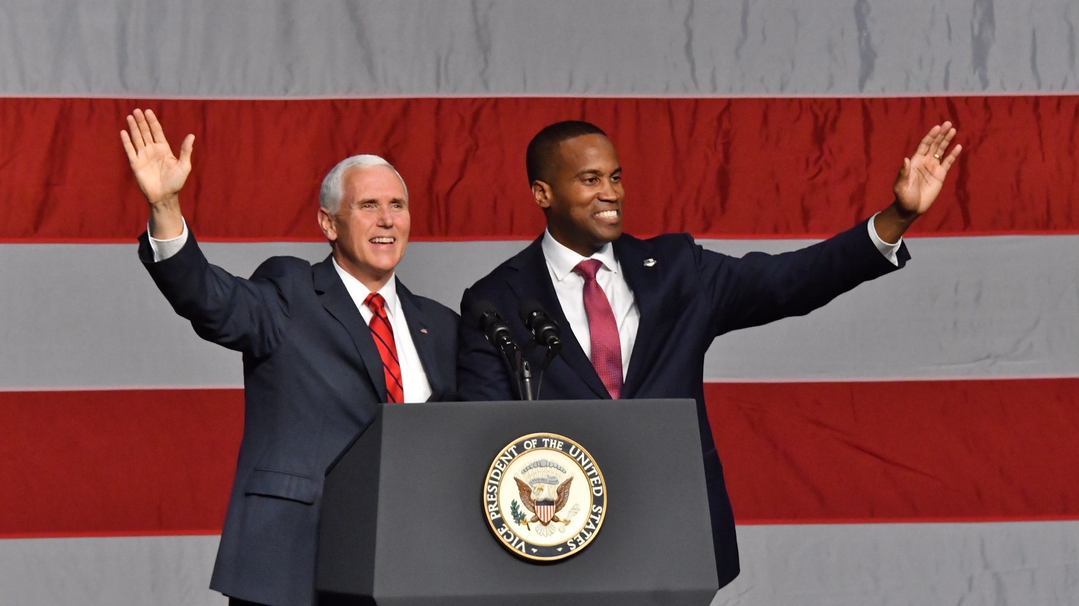 Candidate John James joins Vice President Mike Pence on stage  as the V.P. campaigns with Republican candidates at the DeltaPlex in Grand Rapids on Monday, Oct 29, 2018.
