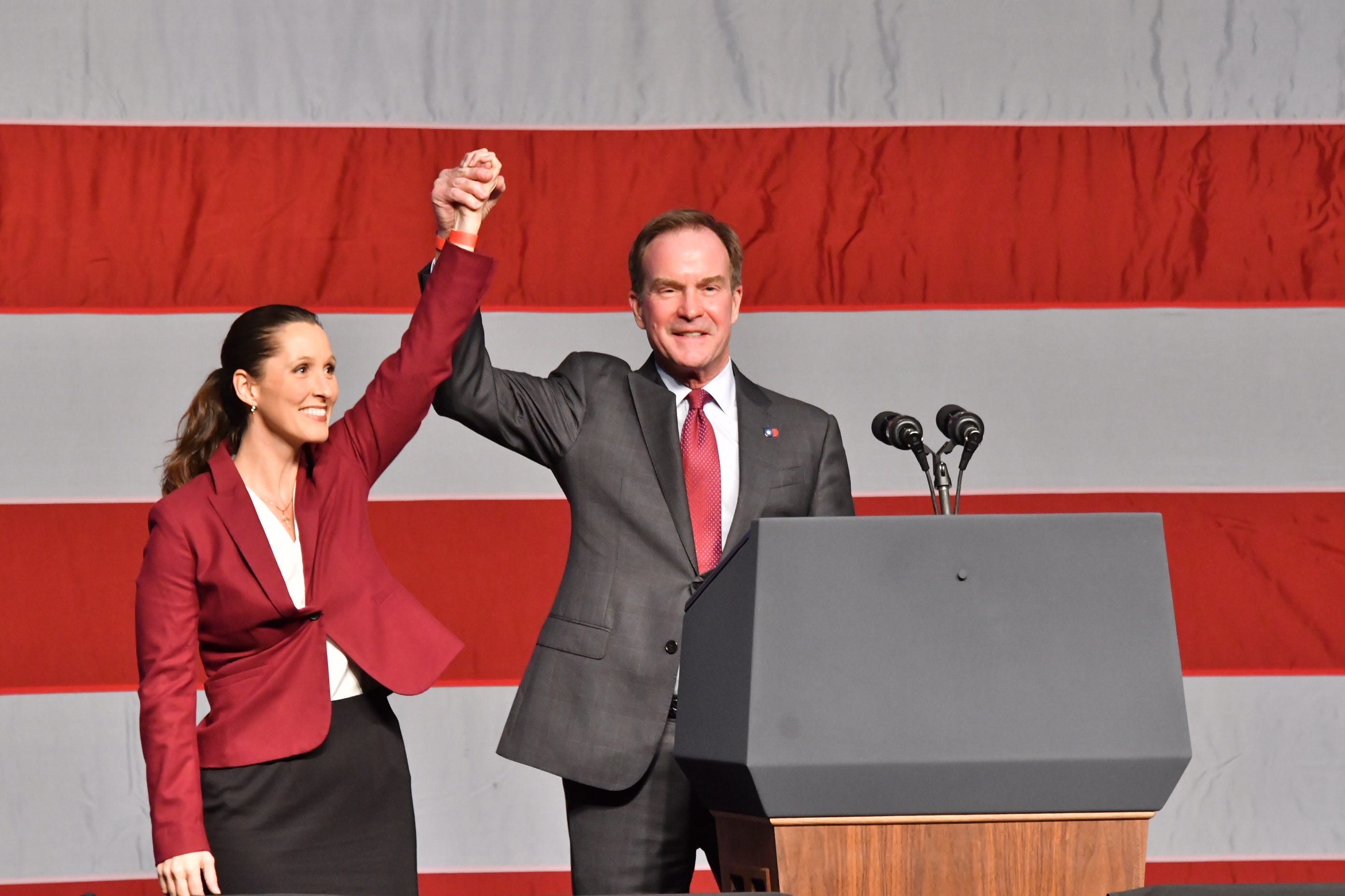 Bill Schuette and Lisa Posthumus Lyons take the stage before Vice President Mike Pence.