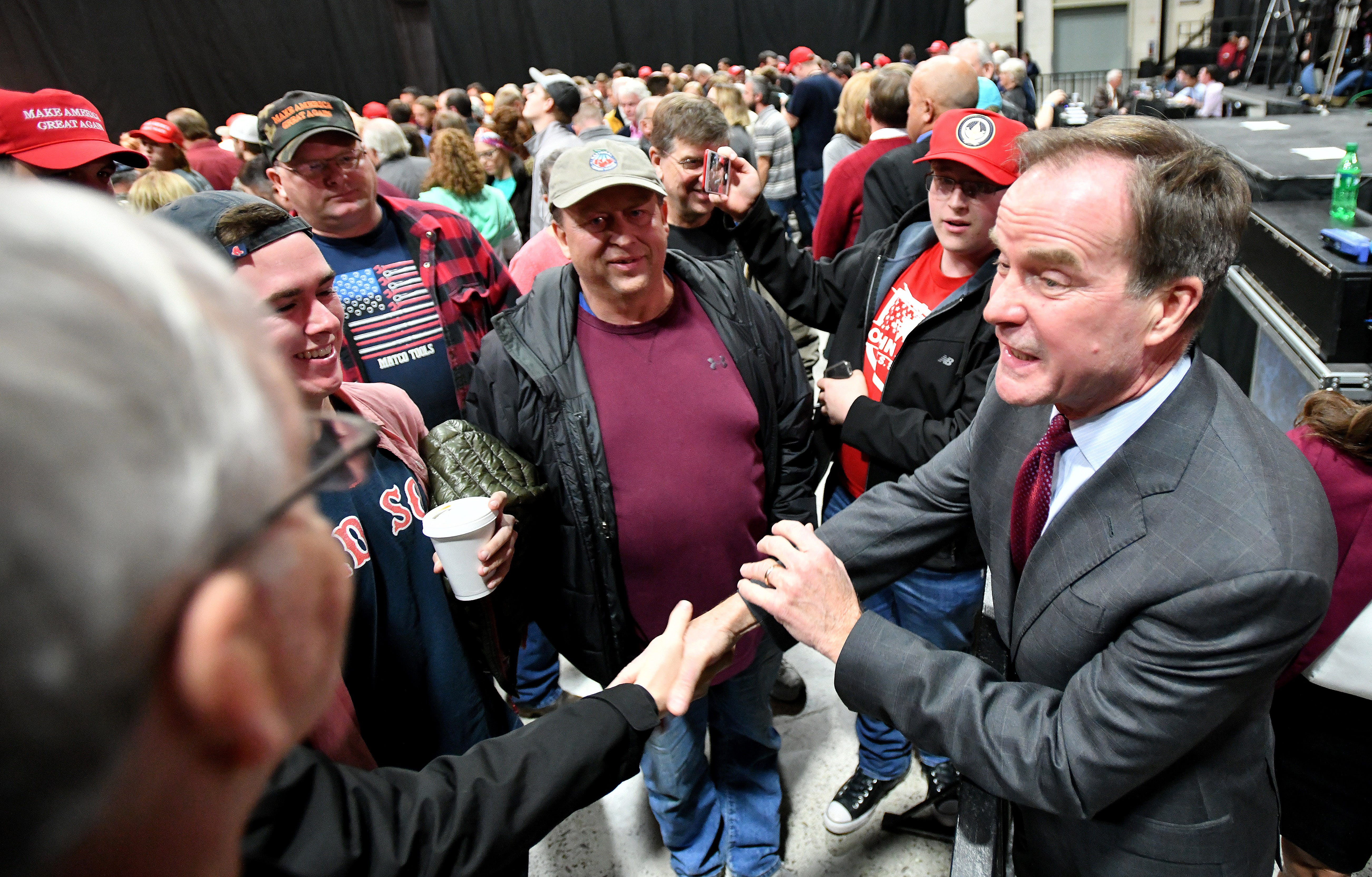 Bill Schuette greet supporters before Vice President Mike Pence campaigns with Republican candidates.