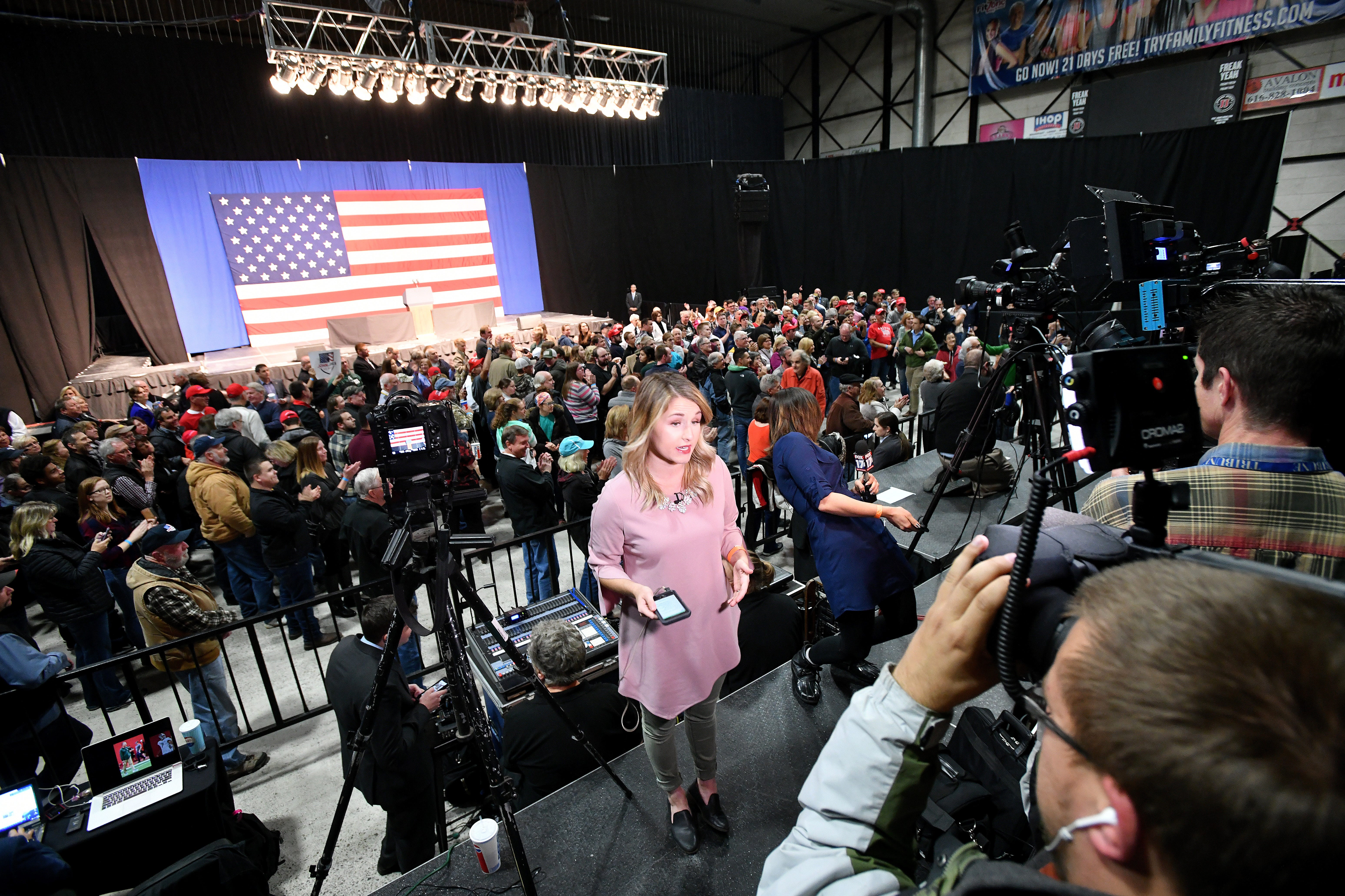 TV reporters warm up before Vice President Mike Pence campaigns with Republican candidates at the DeltaPlex in Grand Rapids on Monday, Oct 29, 2018.