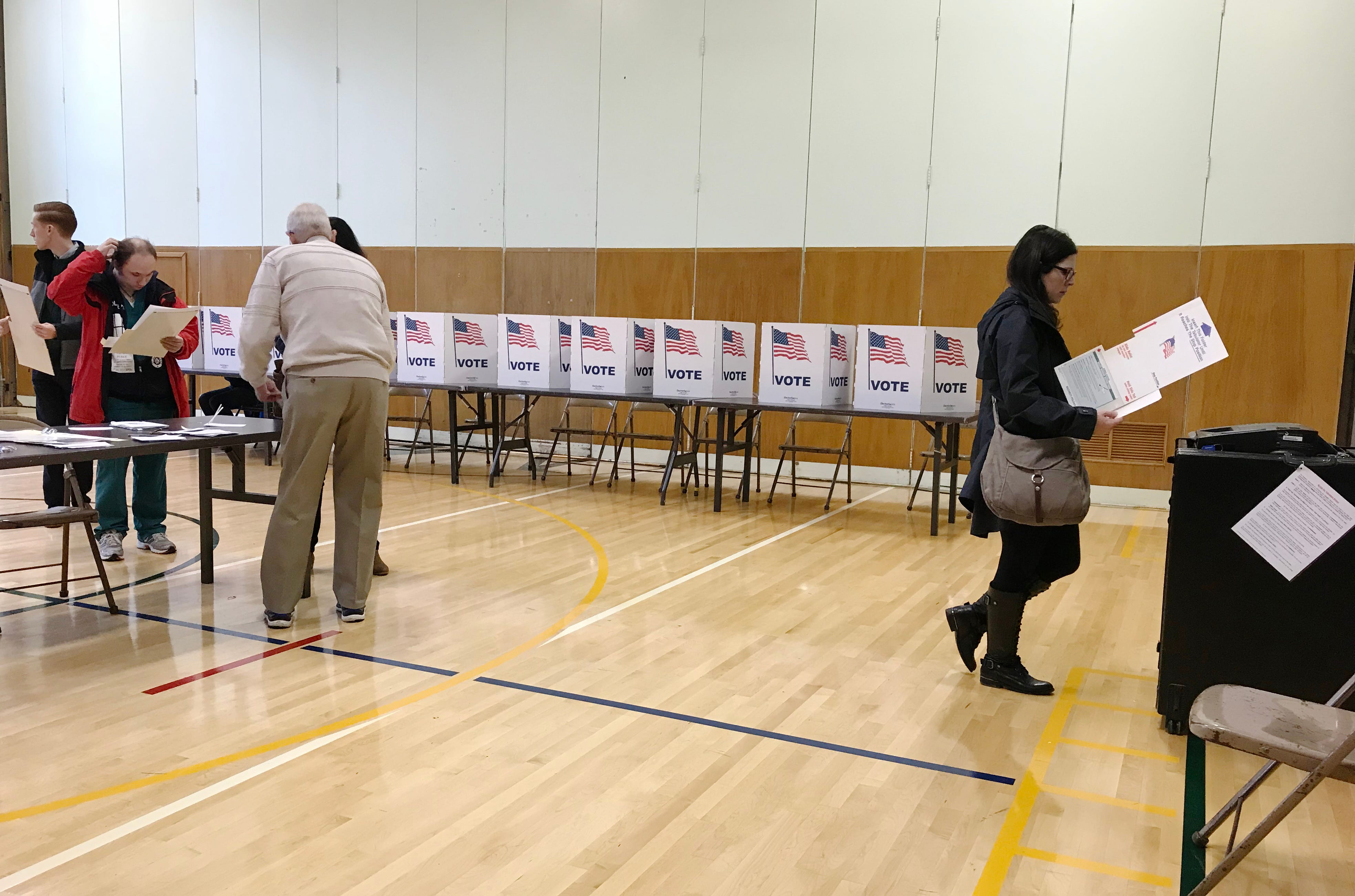 Voters cast their ballots in the gymnasium at Monteith Elementary School on midterm election day, Tuesday, Nov. 6, 2018 in Grosse Pointe Woods, Michigan.