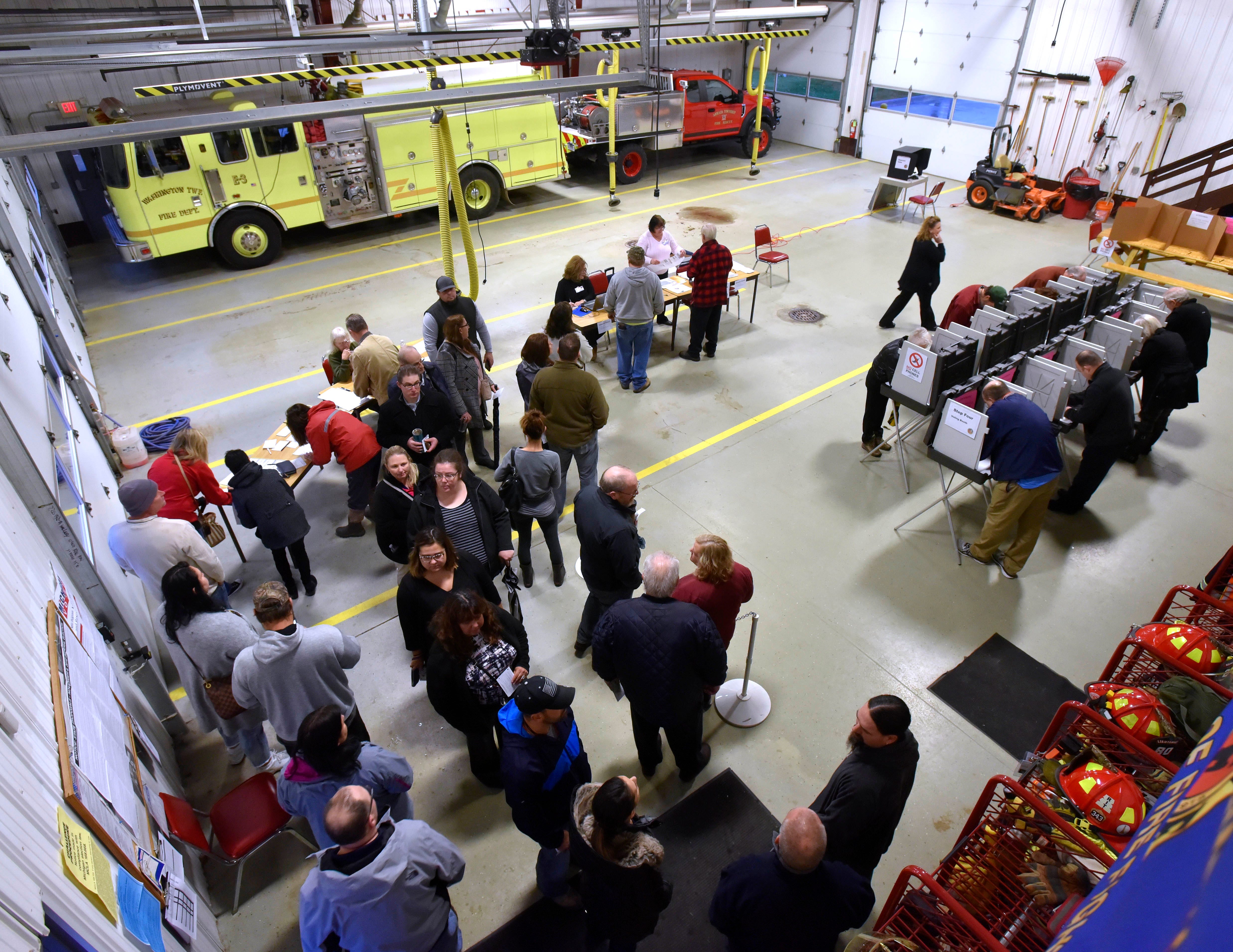 Voter lines serpentine at Precinct 1 inside the Armada Twp. Fire Station Tuesday morning. Among other ballot issues in Armada Twp. is a fire protection millage increase, which would provide additional funding for new fire trucks and fire fighting equipment replacement.