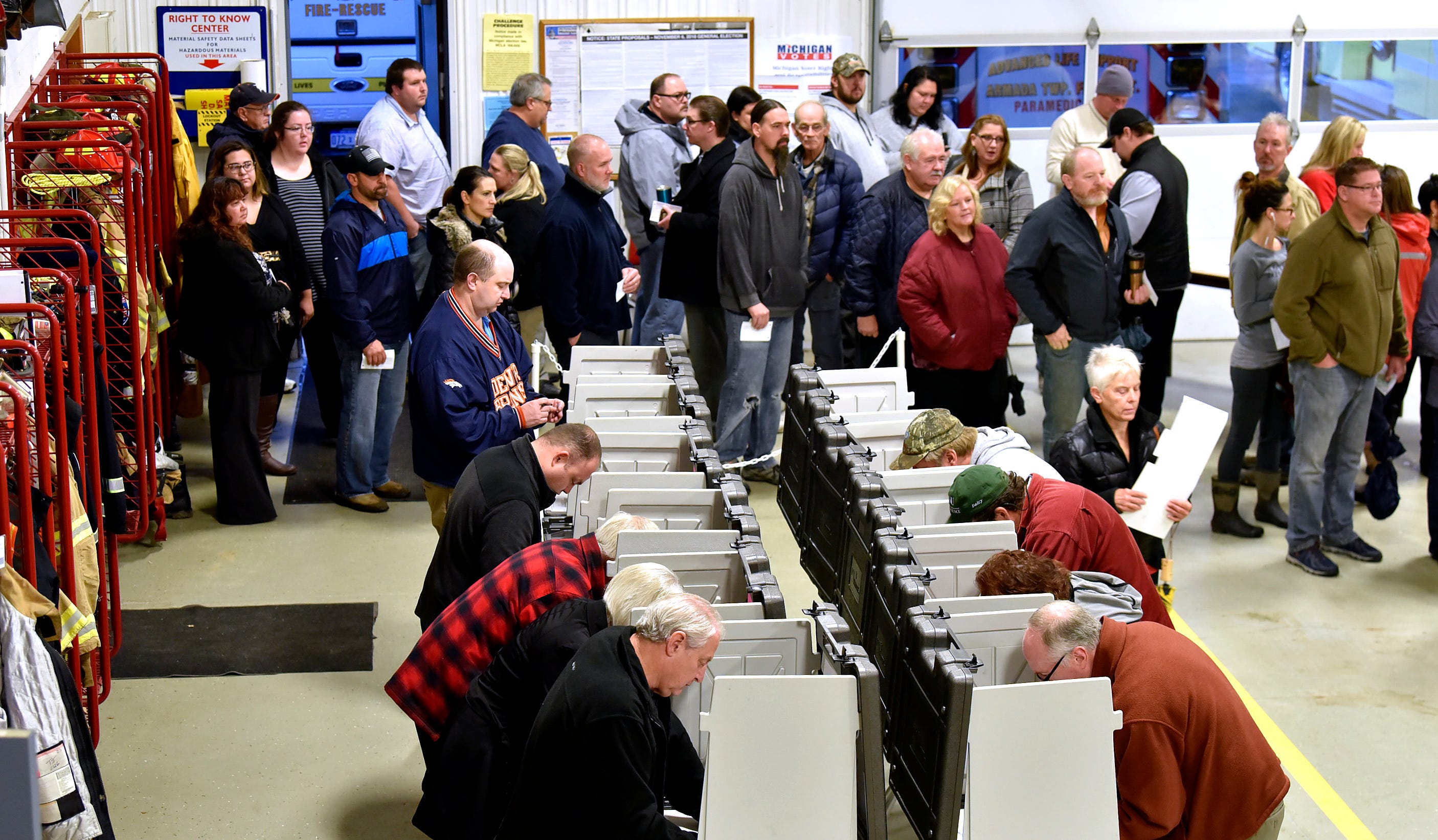 Voter lines serpentine at Precinct One inside the fire bay at the Armada Twp. Fire Department, Tuesday morning, Nov. 6, 2018. Armada Township voters are considering an increase to a Fire Protection Millage, which would provide additional funding for new fire trucks and firefighting equipment.