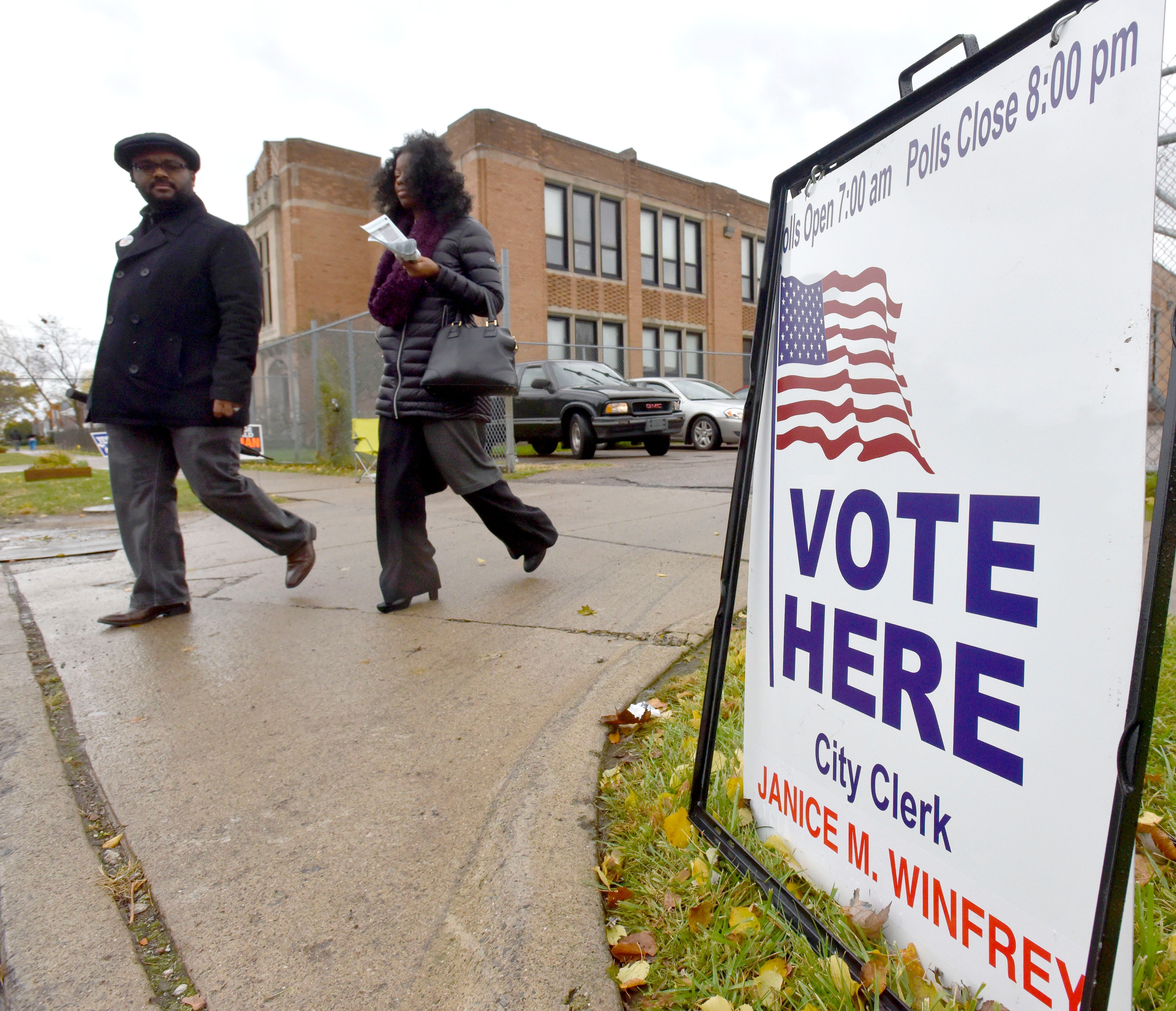 Residents leave after casting their ballots in the gym at Brewer Elementary School in Detroit, Tuesday afternoon, Nov. 6, 2018.