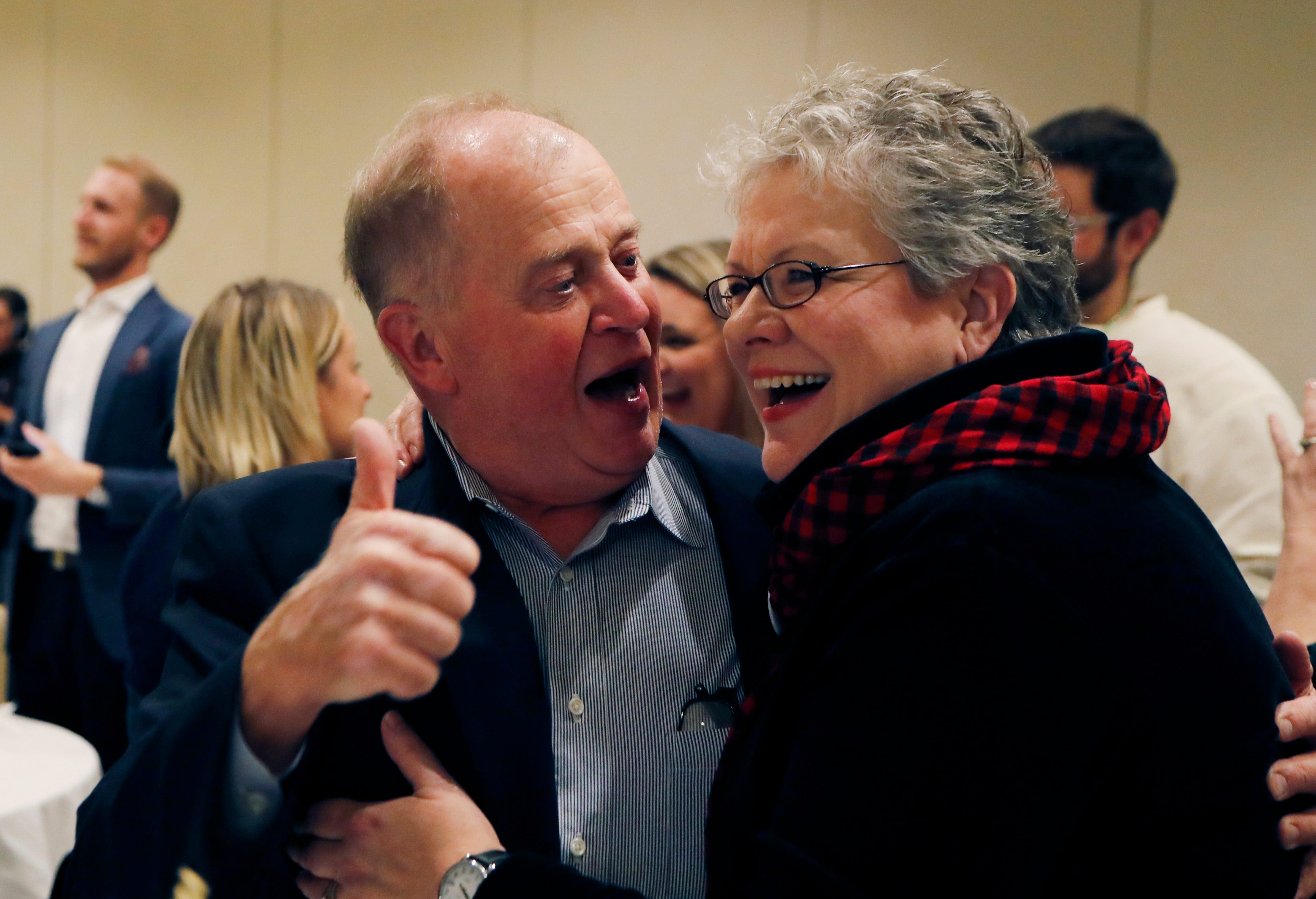 Jim and Maria Stevens react after learning their daughter Haley Stevens was the projected winner for Michigan's 11th Congressional District seat at an election night party in Birmingham.