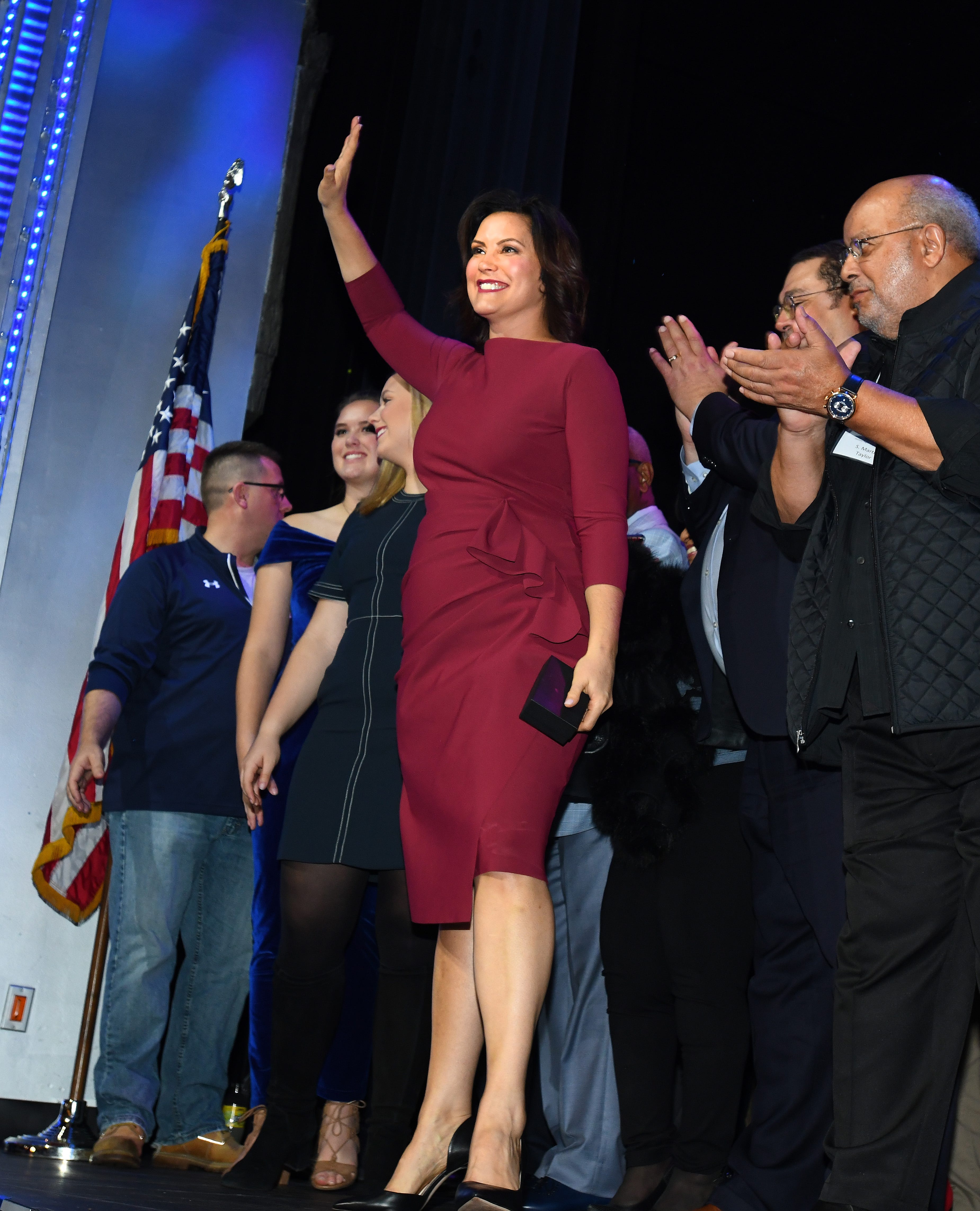 Michigan governor-elect Gretchen Whitmer waves to her supporters with other Democratic Party candidates at the Sound Board theater in the MotorCity Casino in Detroit, Tuesday night.