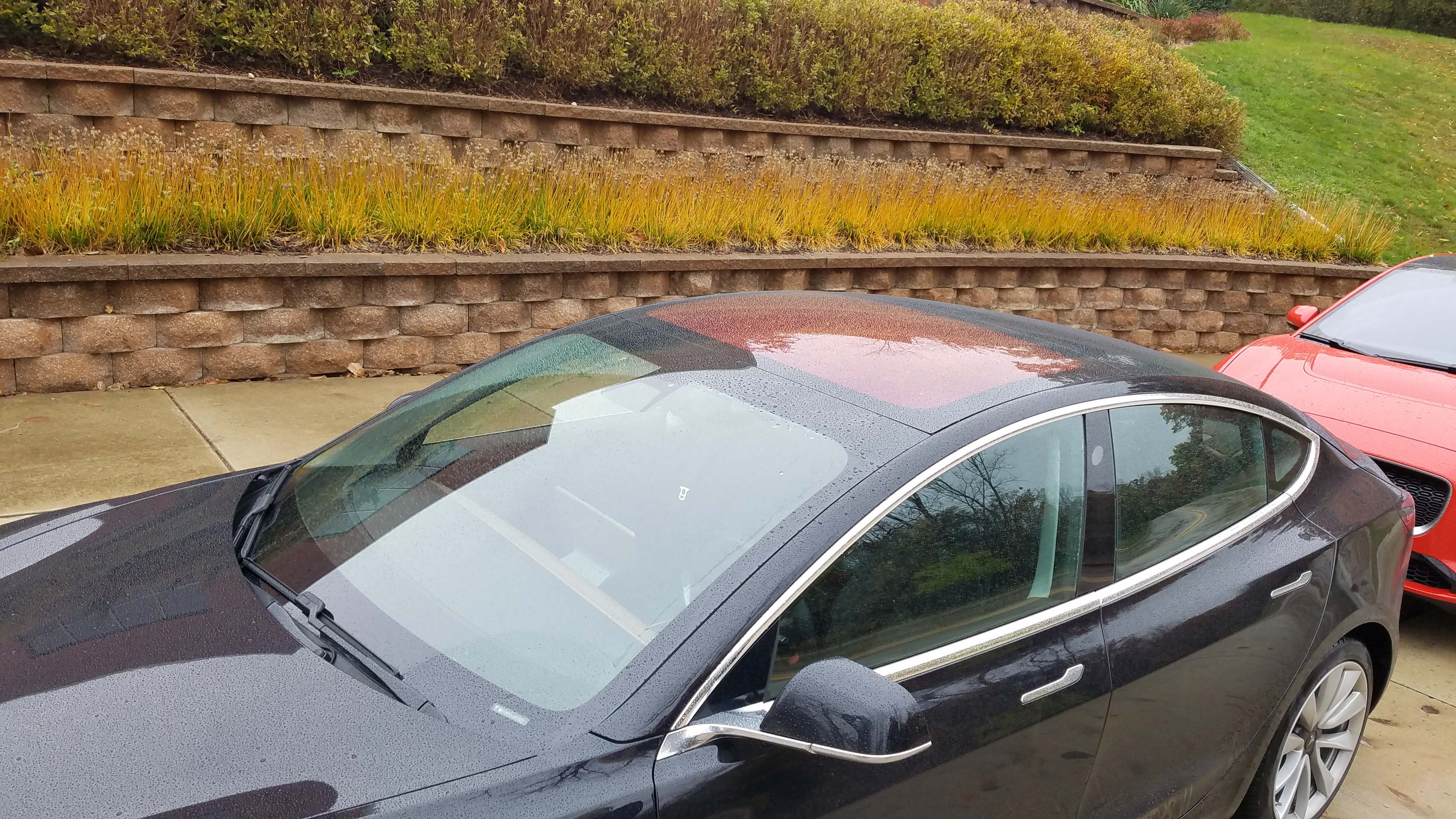 After a rain, the Tesla Model 3 roof will turn orange — thanks to a UV ray-reflector in the sunroof.