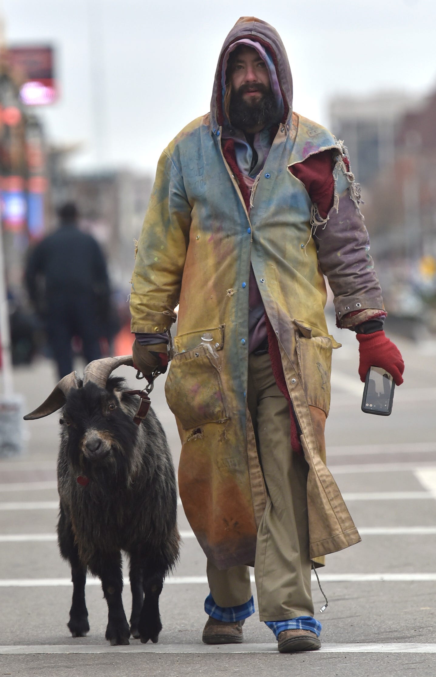 Erick Brown, of Detroit, leads his six-year-old male goat named Deer.